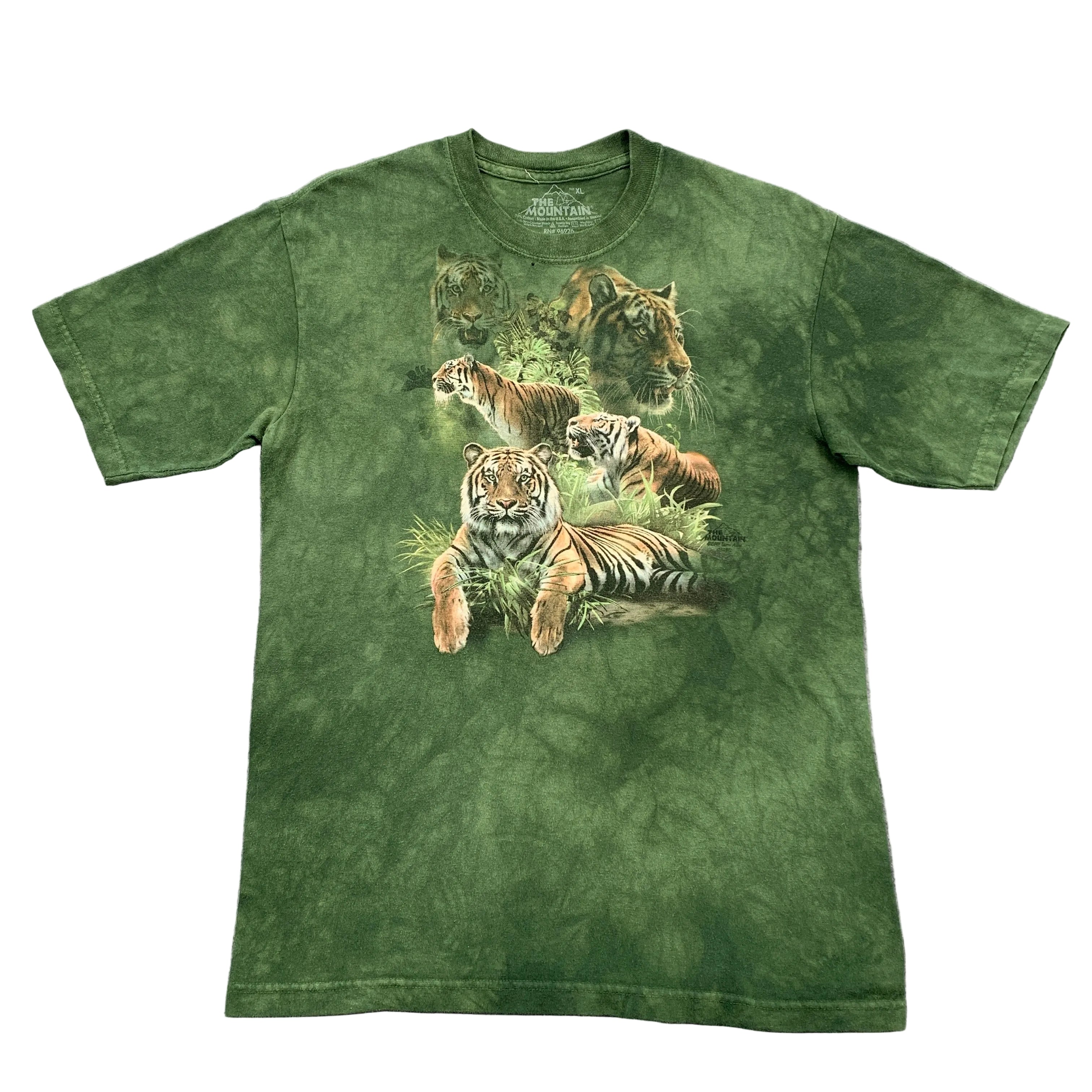 Green t-shirt with tiger design on a gray surface