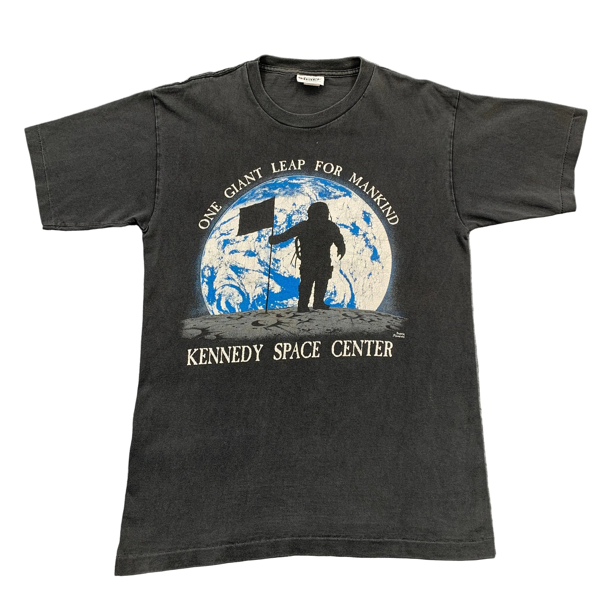 Black t-shirt with Kennedy Space Center graphic on a gray background