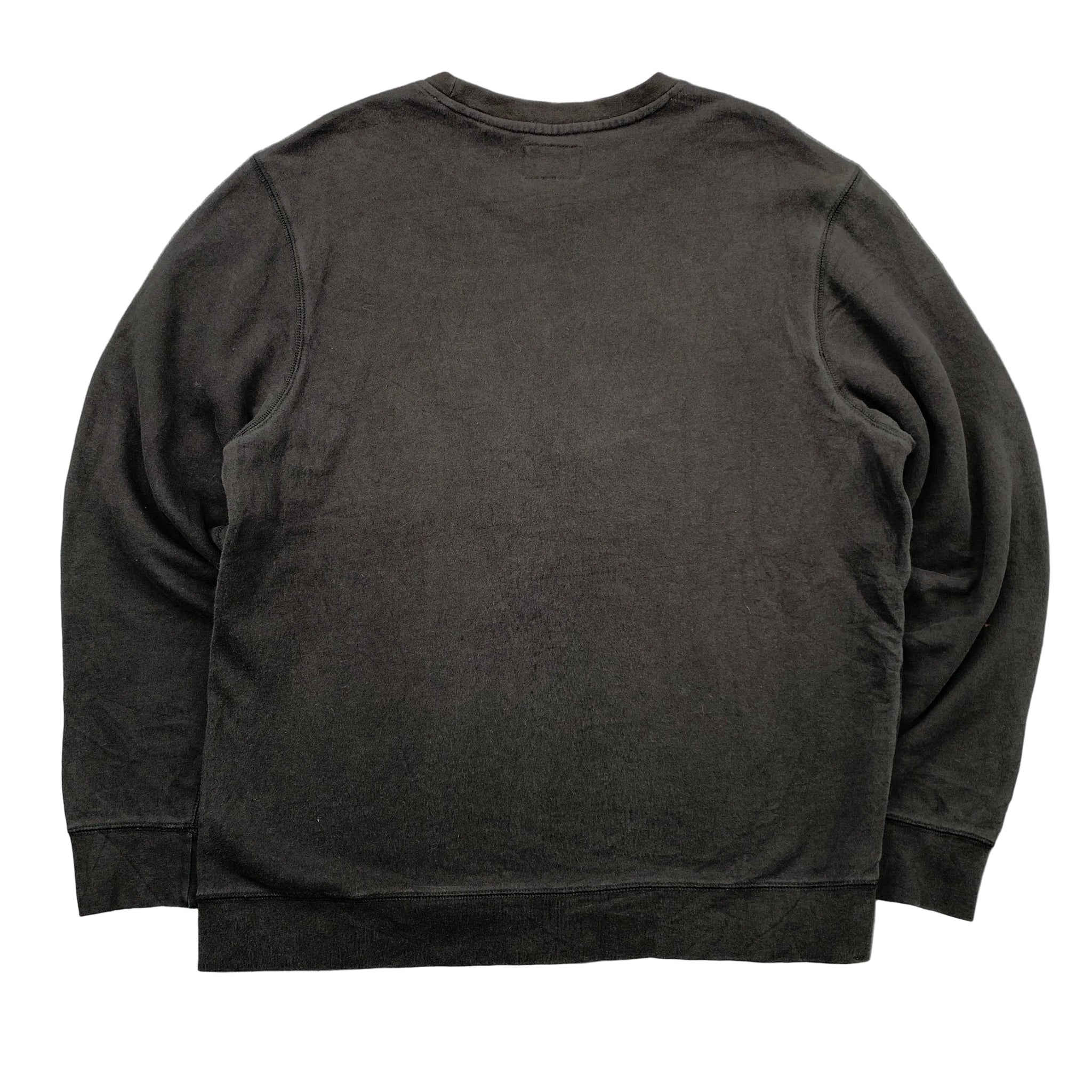 Black sweatshirt on a gray textured background