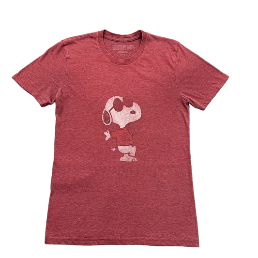 Red t-shirt with a white graphic on a gray surface