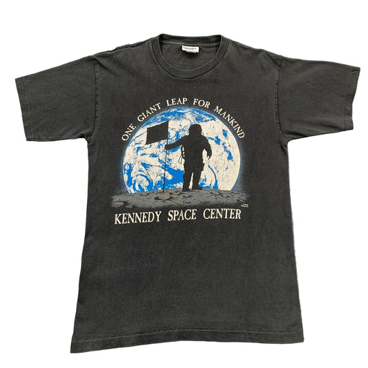 Black t-shirt with Kennedy Space Center graphic on a gray background