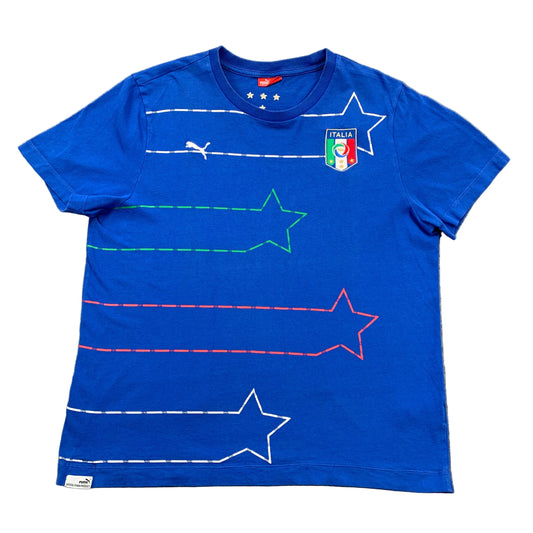 Blue t-shirt with star designs and Italian flag on a gray surface