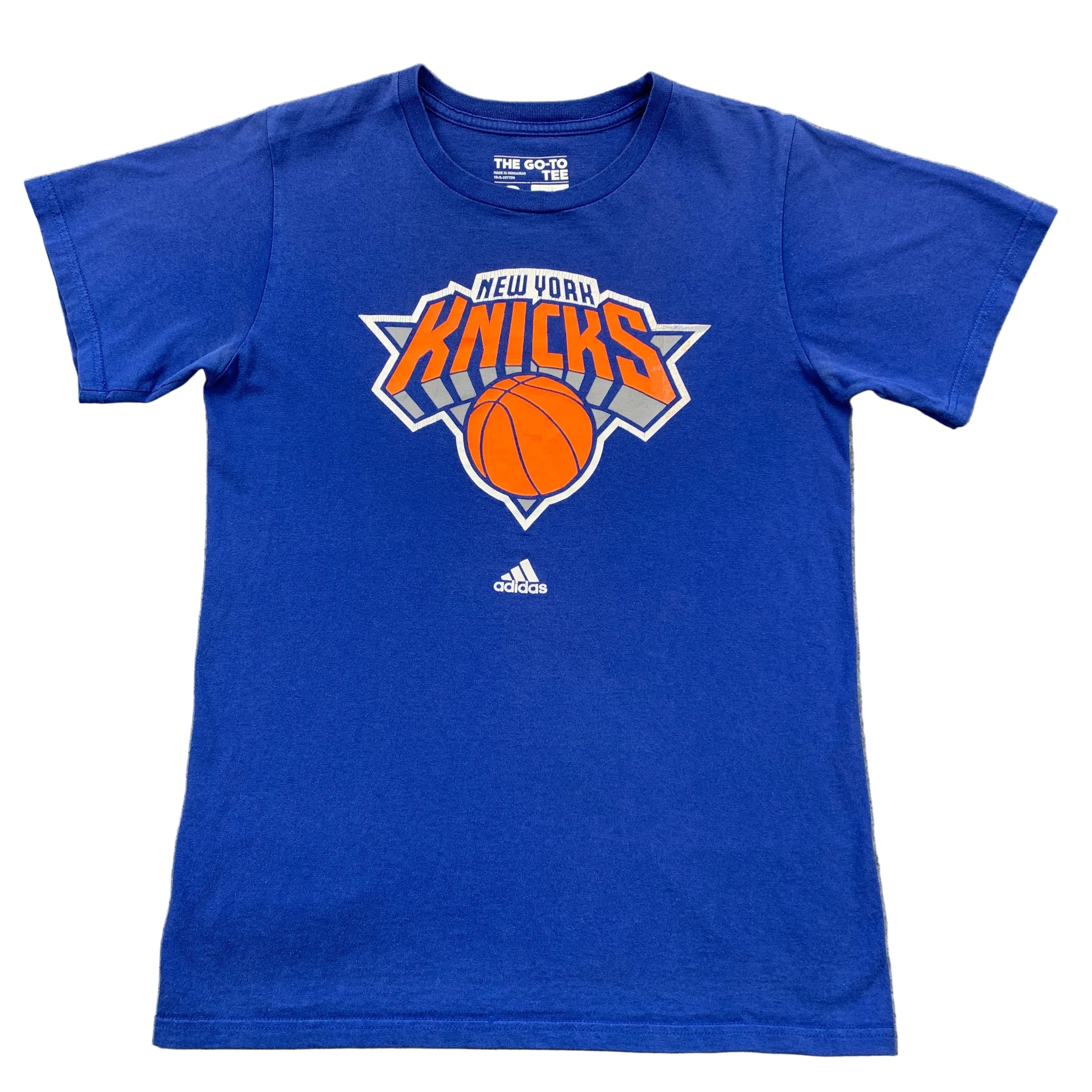 Blue t-shirt with New York Knicks logo on a gray background