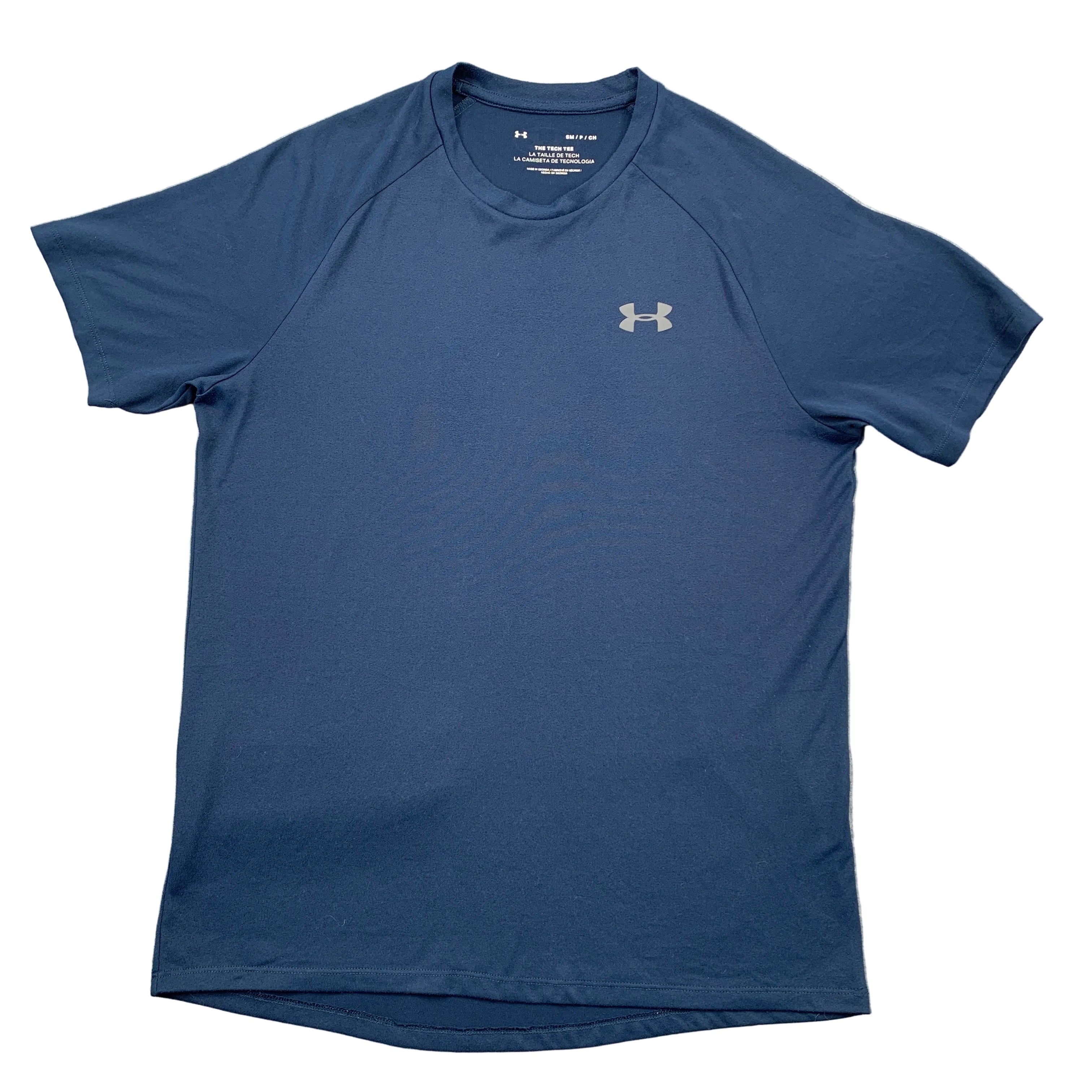 Blue t-shirt with Under Armour logo on a gray surface