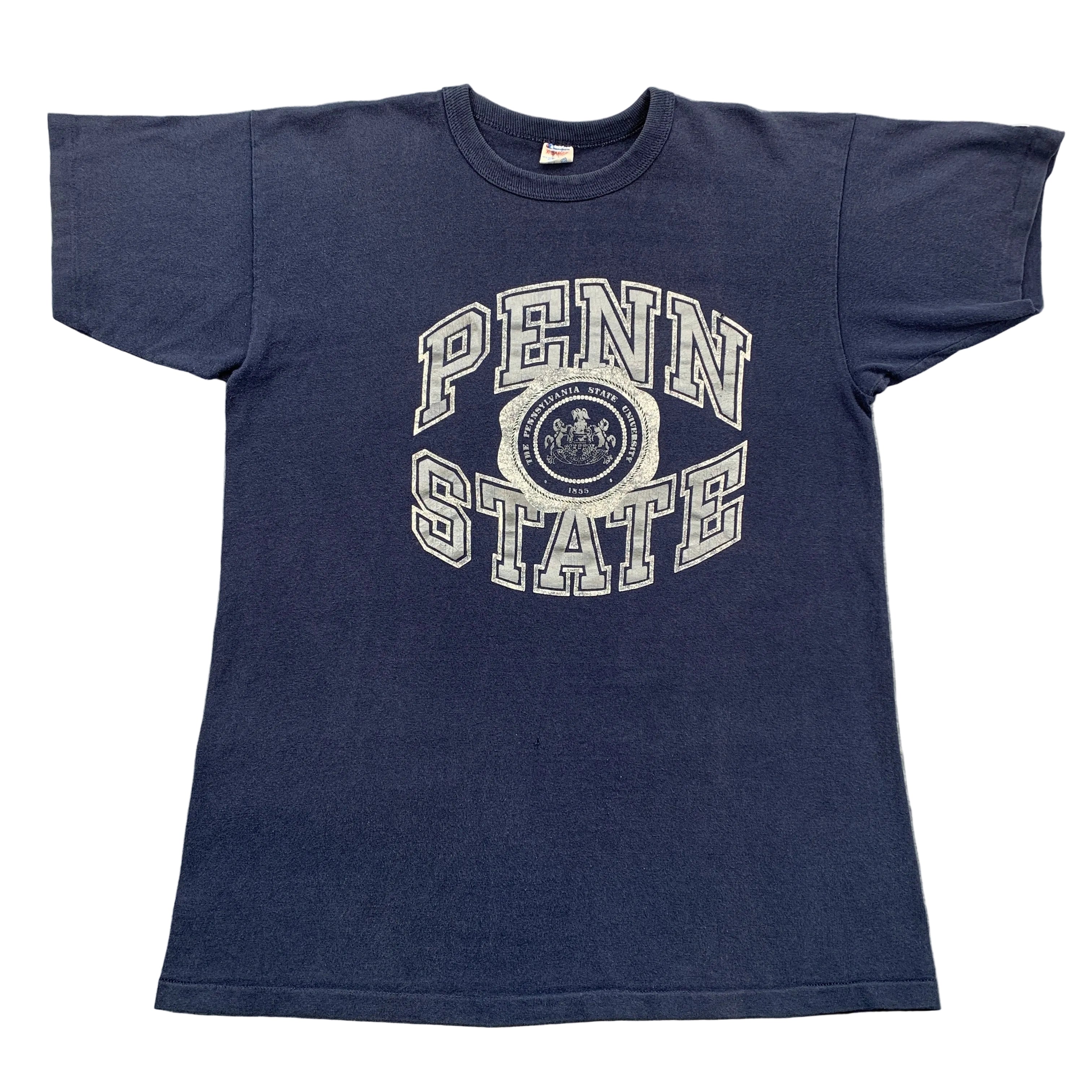 Navy blue t-shirt with 'Penn State' logo on a gray surface