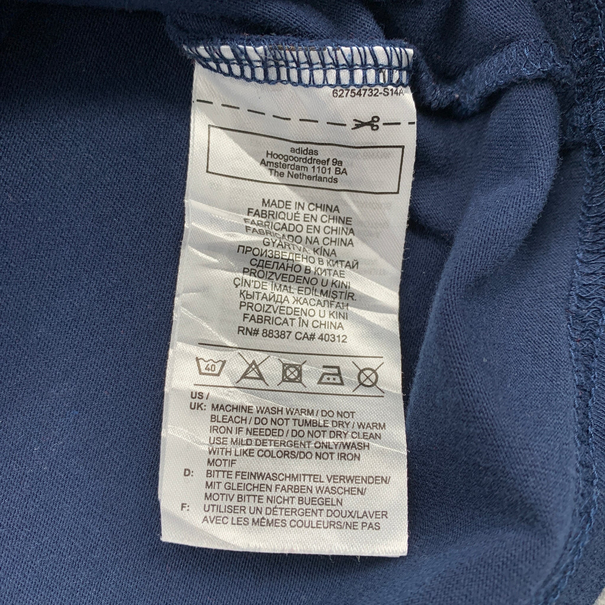 Clothing label on a blue fabric background