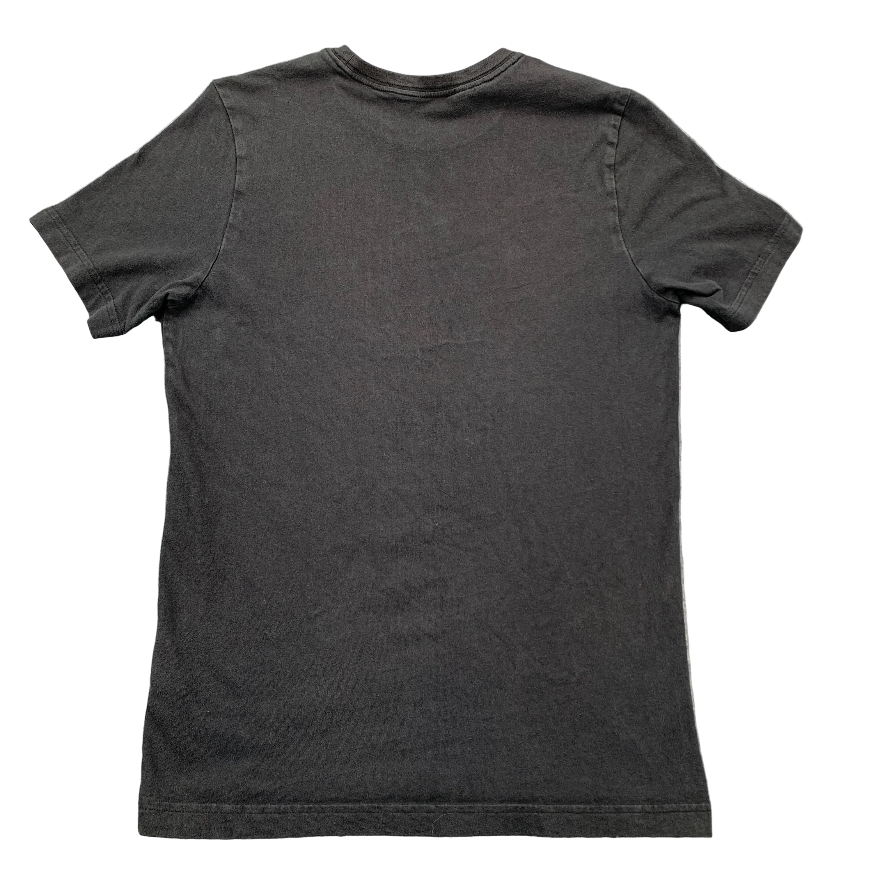 Black t-shirt on a gray textured surface