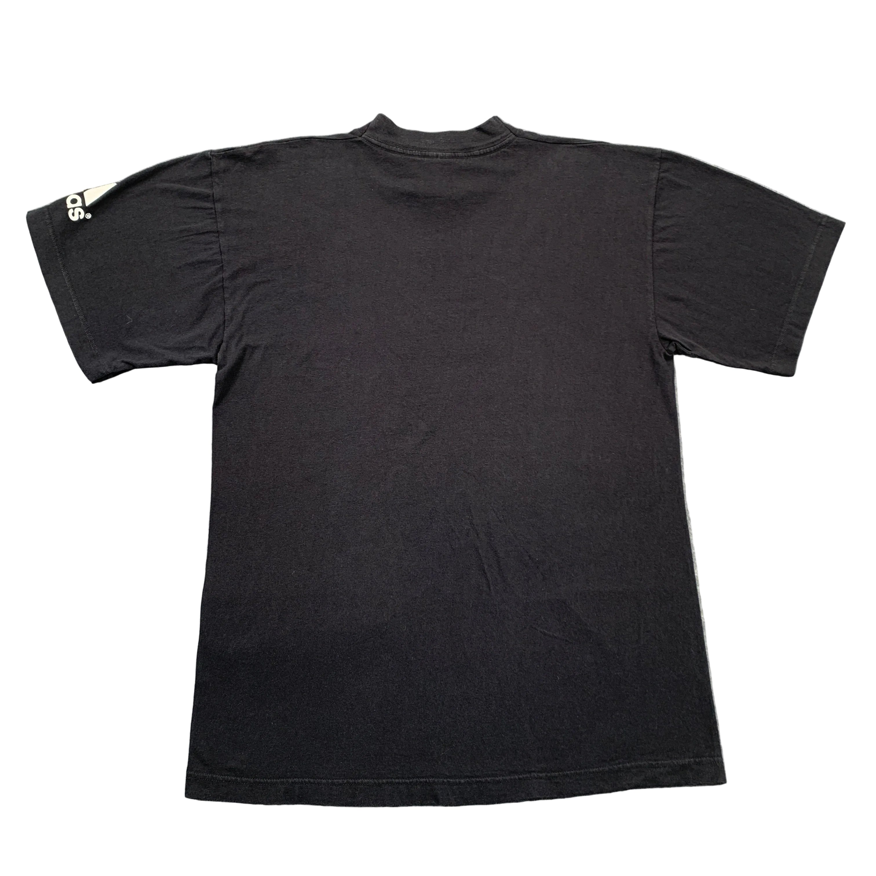 Black t-shirt on a gray textured surface