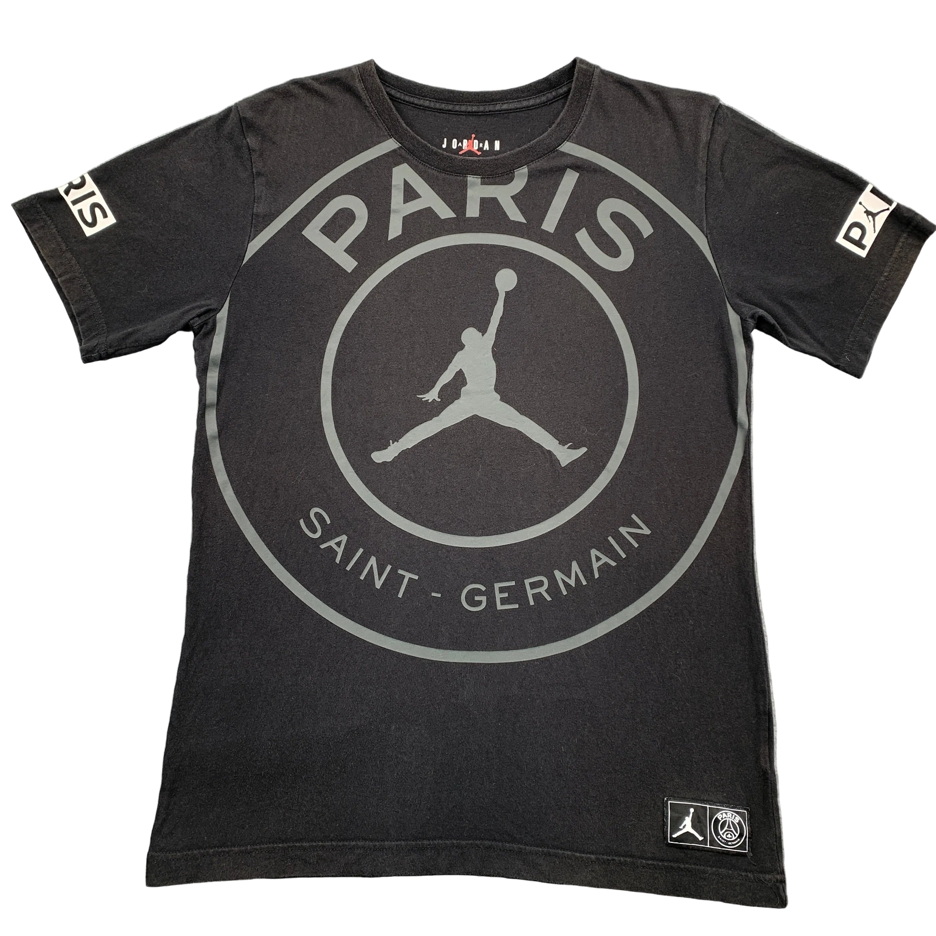 Black t-shirt with Paris Saint-Germain and Jordan logos on a gray surface