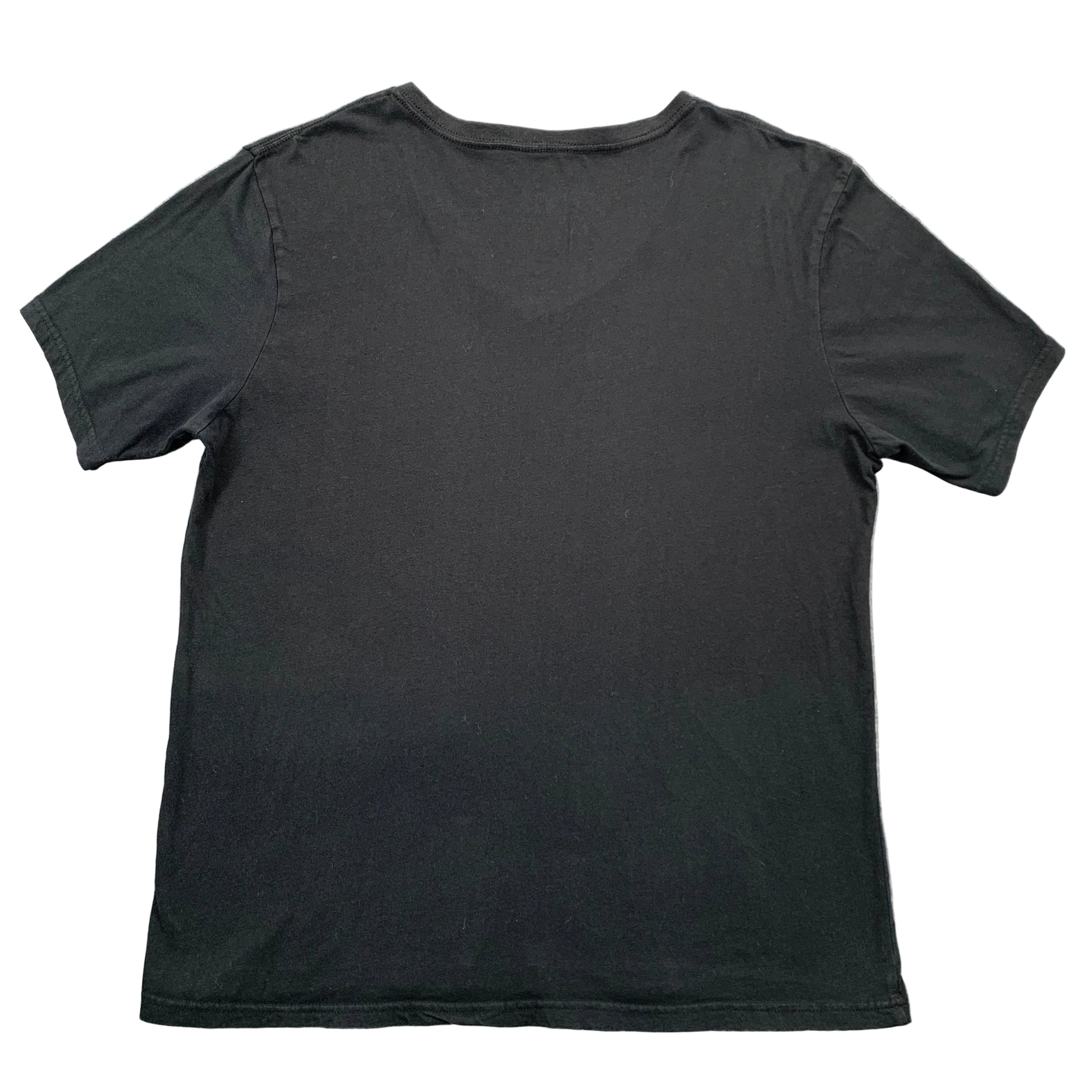 Black t-shirt on a gray textured surface