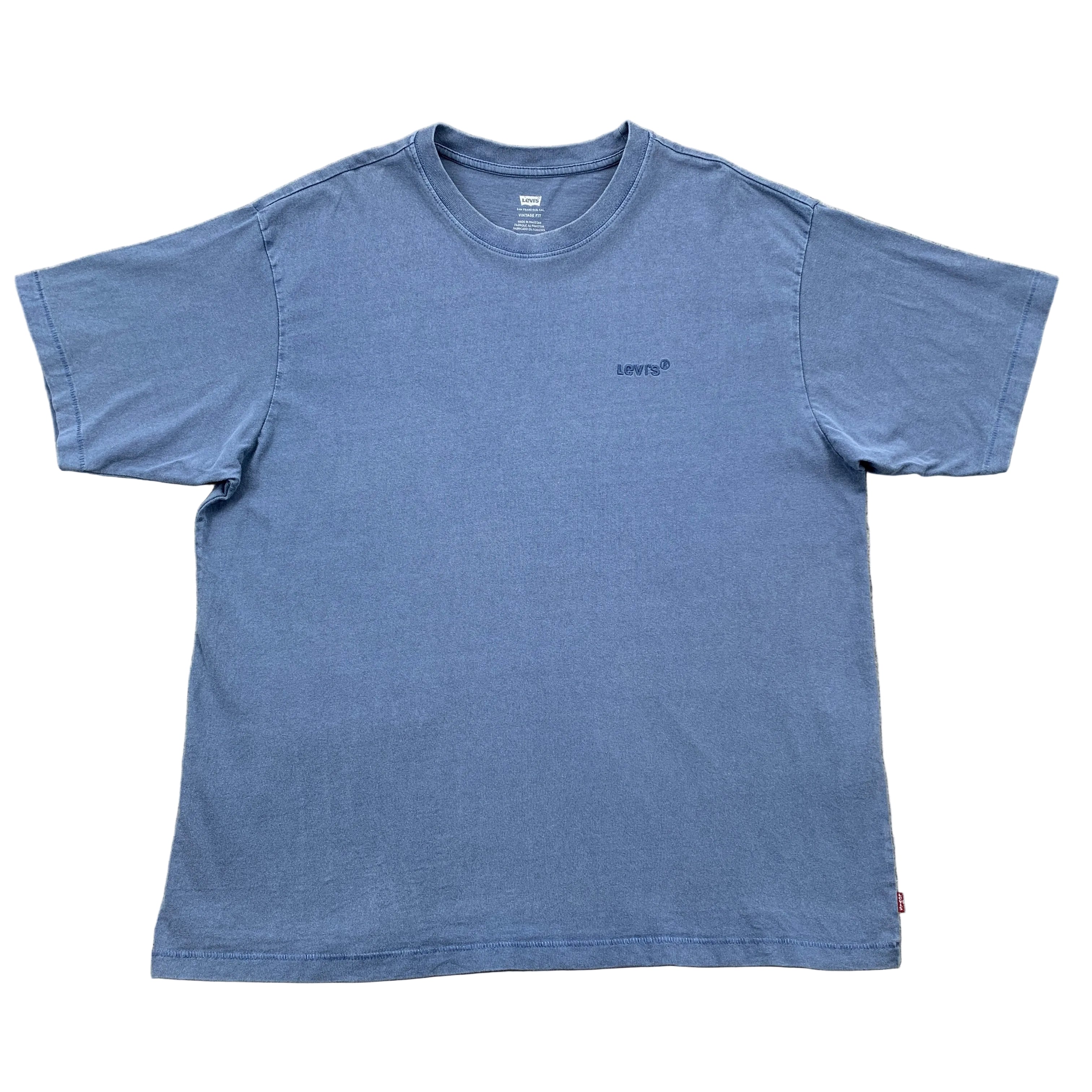 Blue t-shirt with Levi's logo on a gray concrete surface