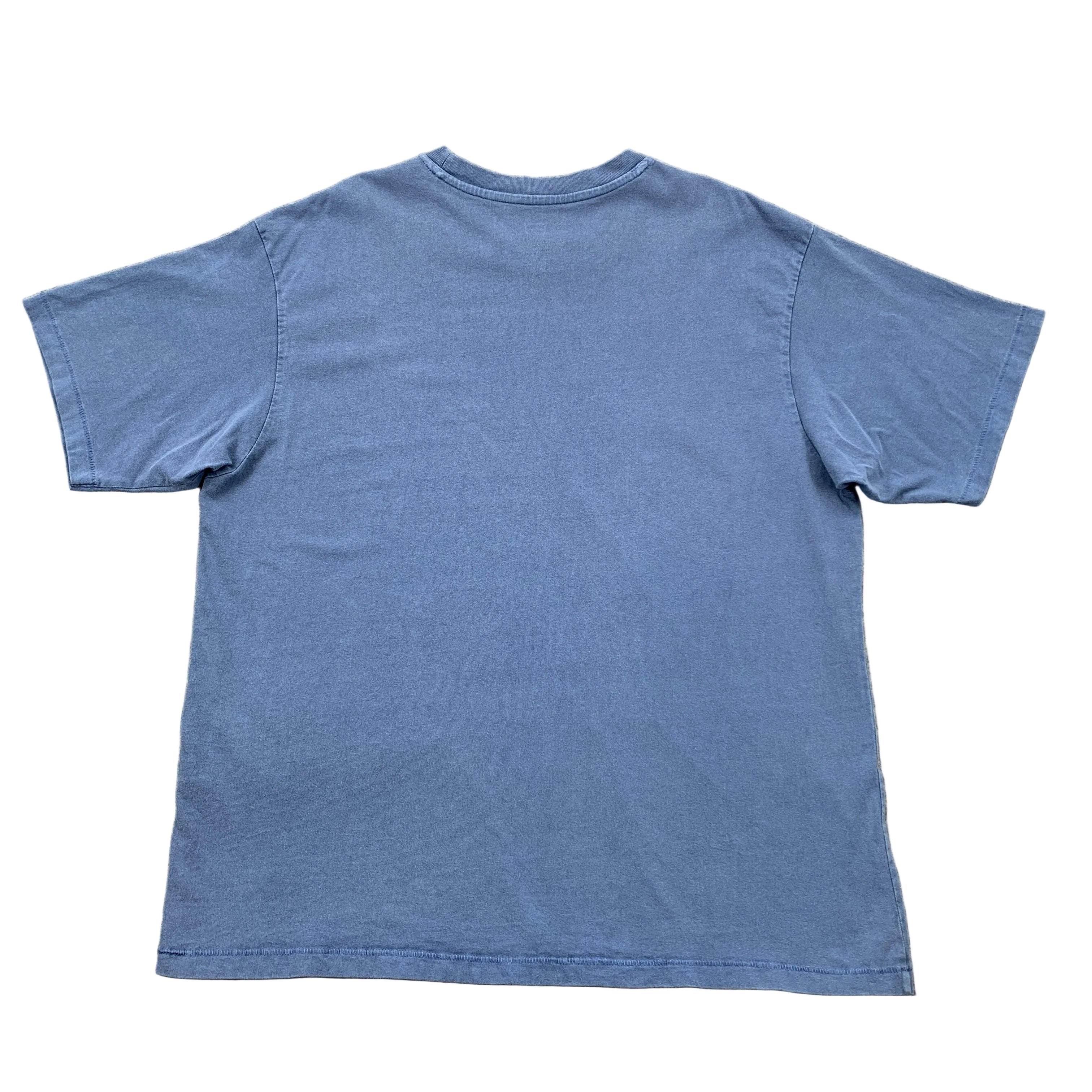 Blue t-shirt on a gray textured surface