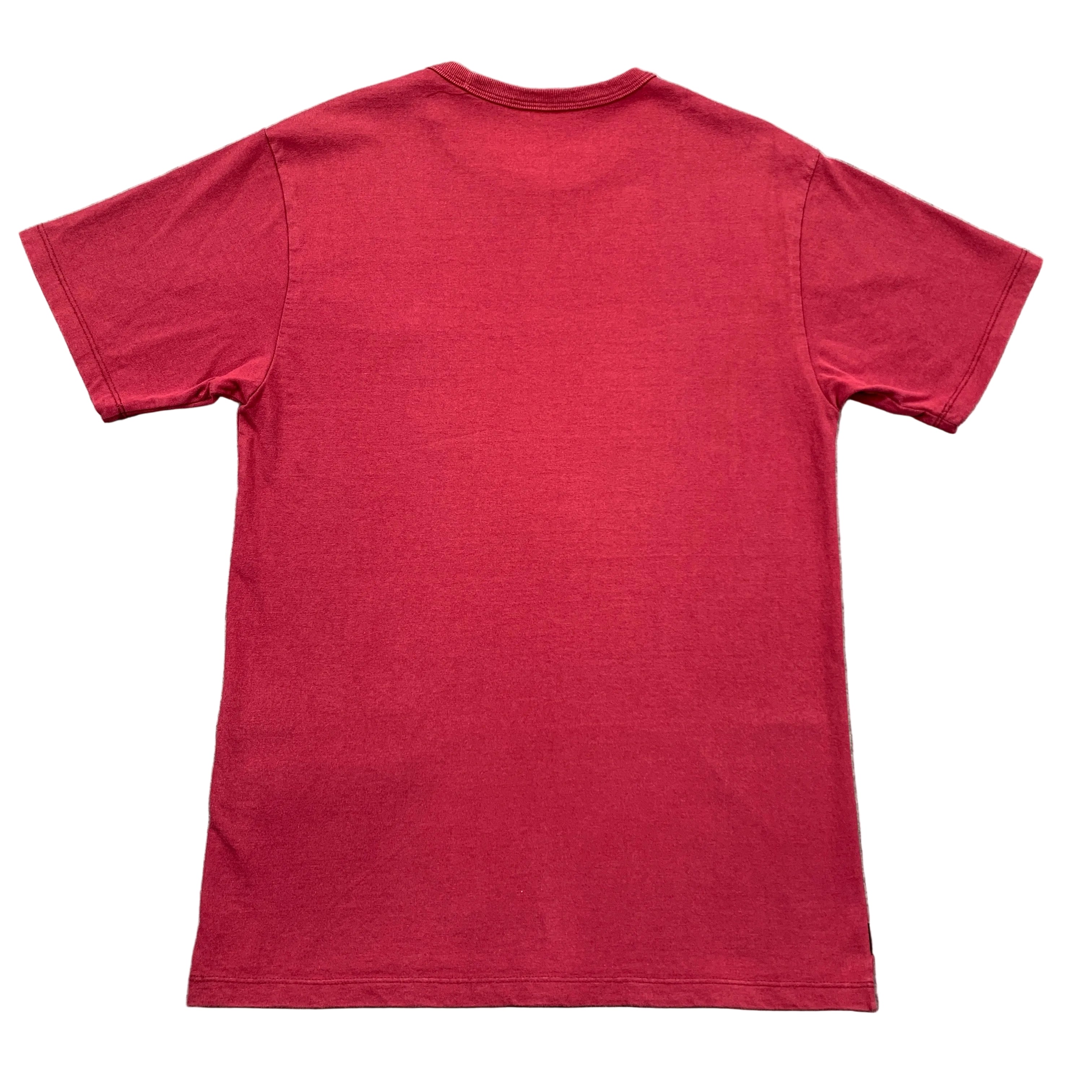 Red t-shirt on a gray textured surface