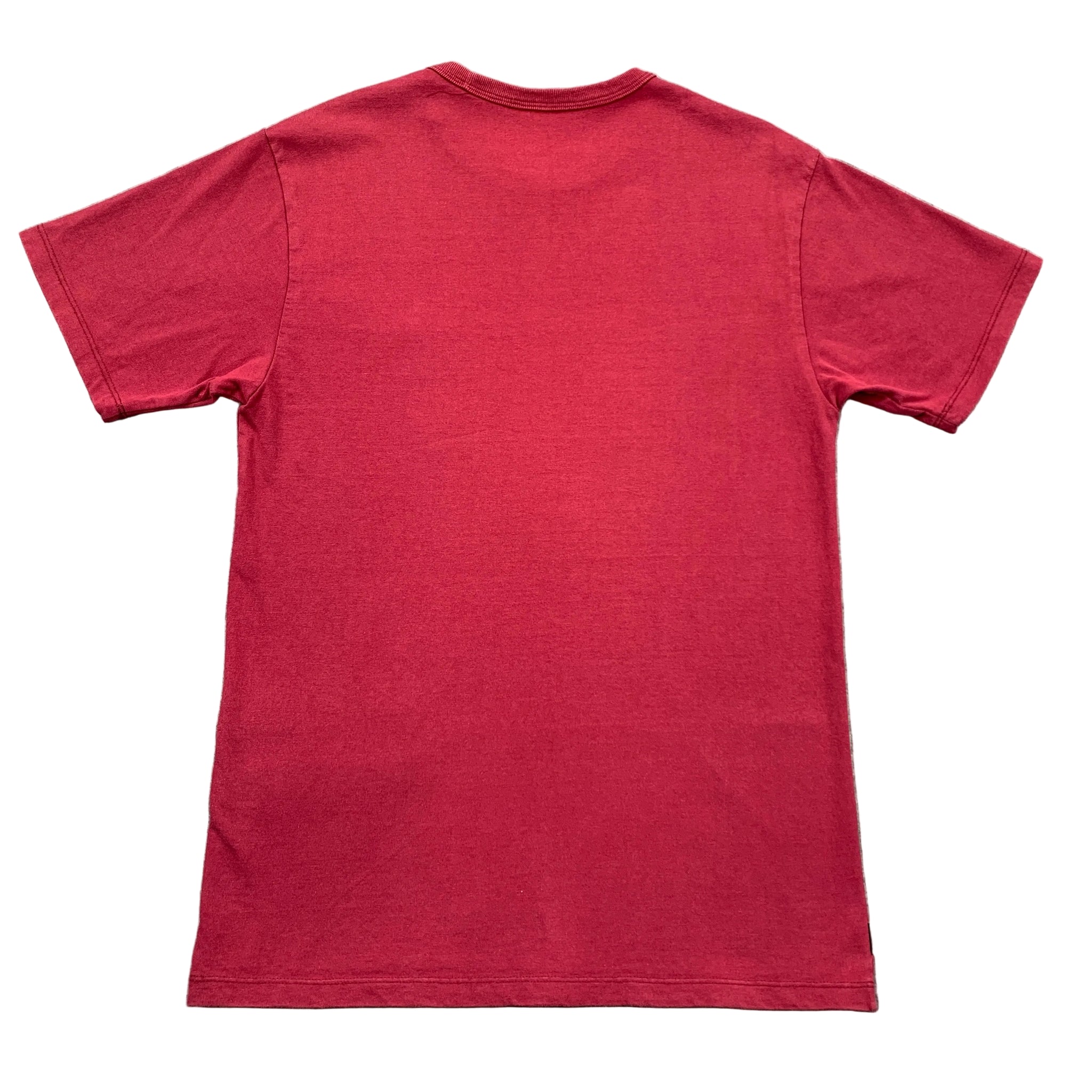 Red t-shirt on a gray textured surface