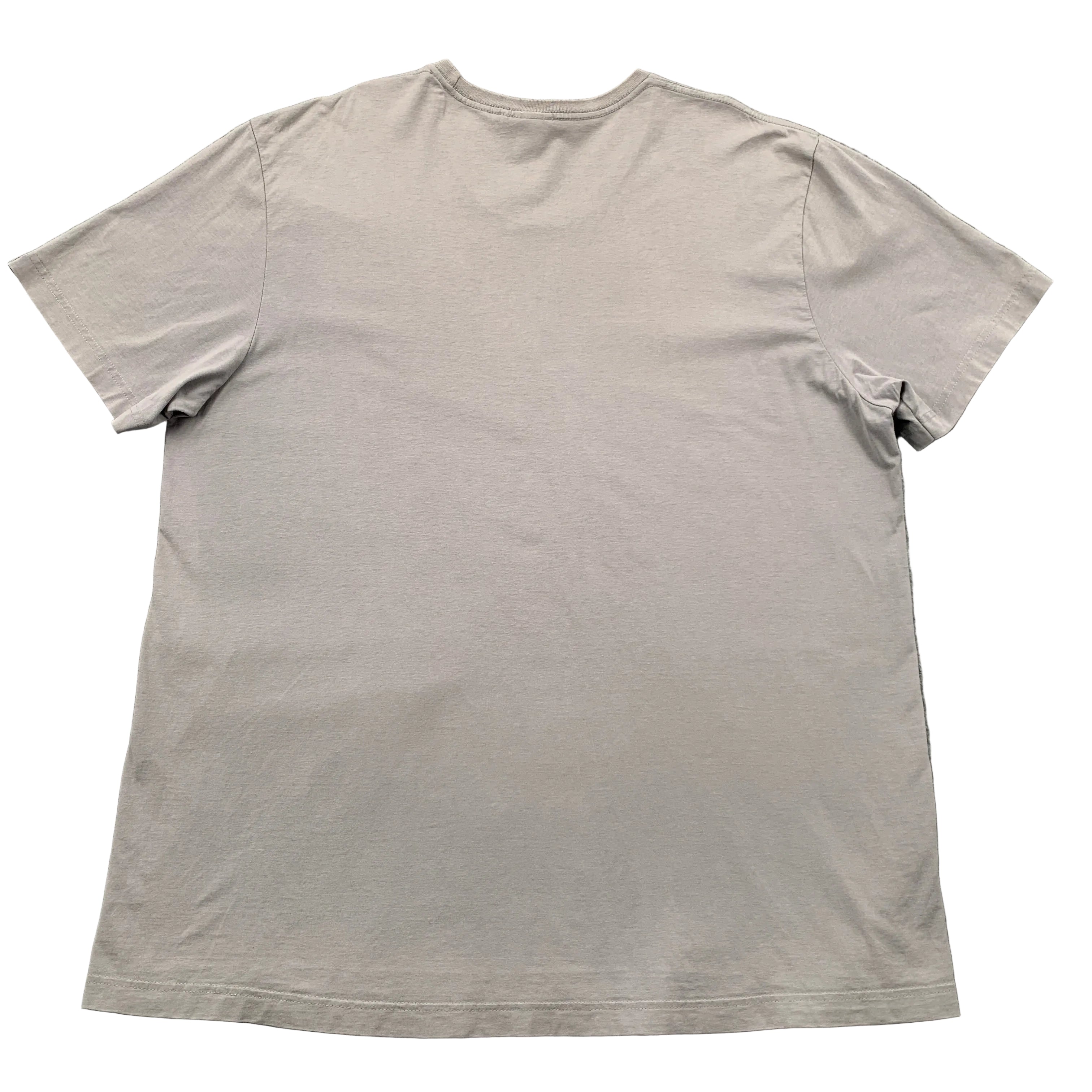 Beige t-shirt on a gray textured surface