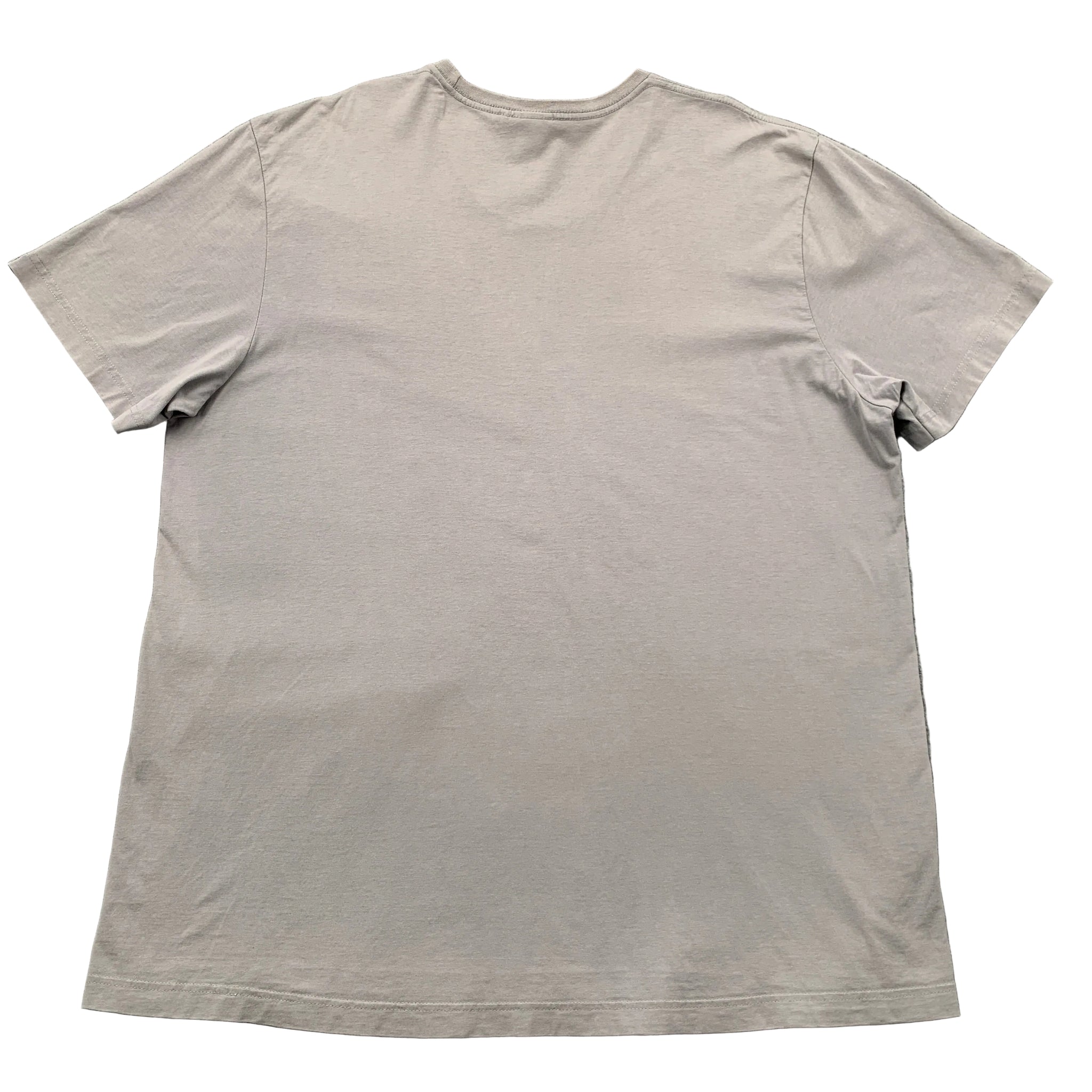 Beige t-shirt on a gray textured surface