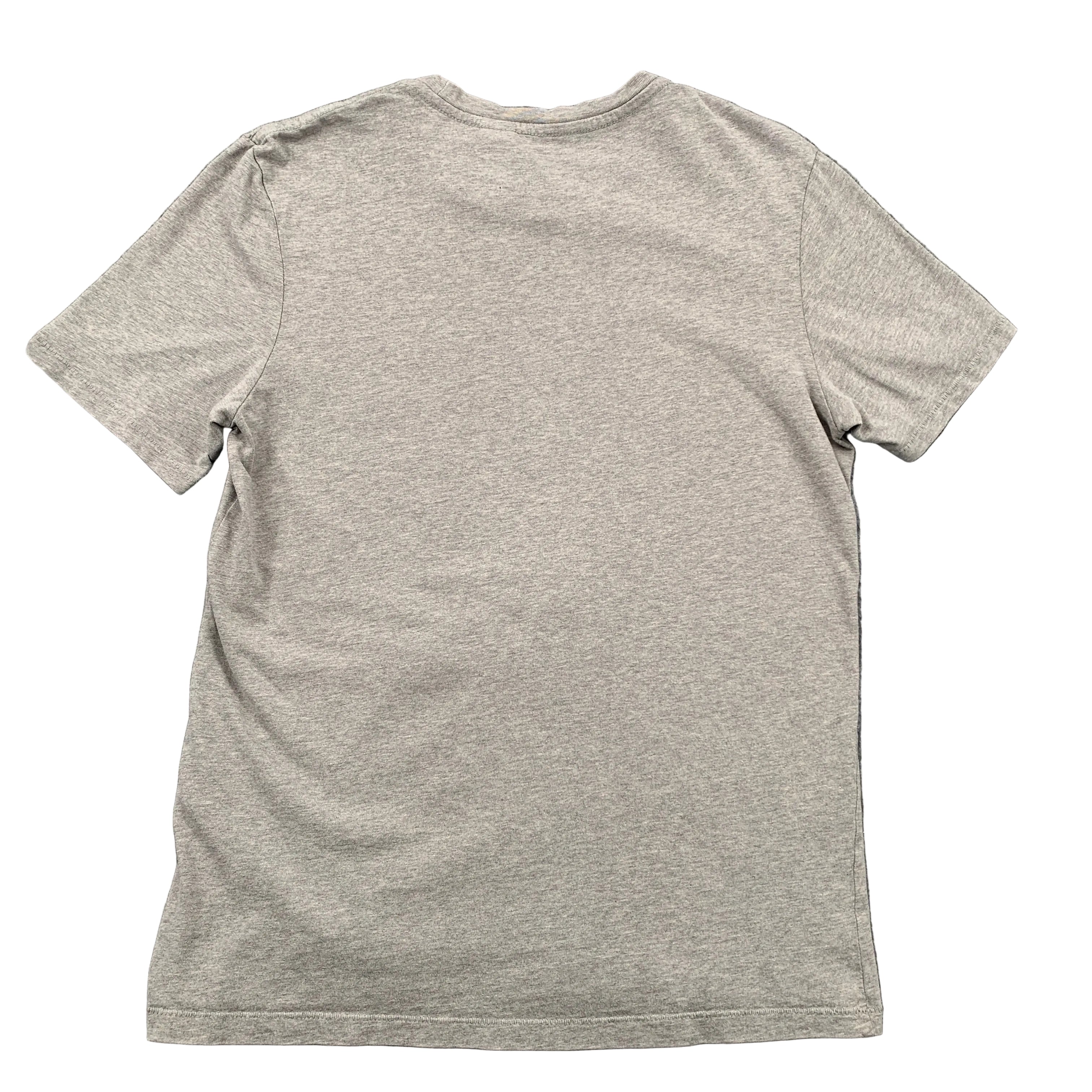 Gray t-shirt on a gray textured background