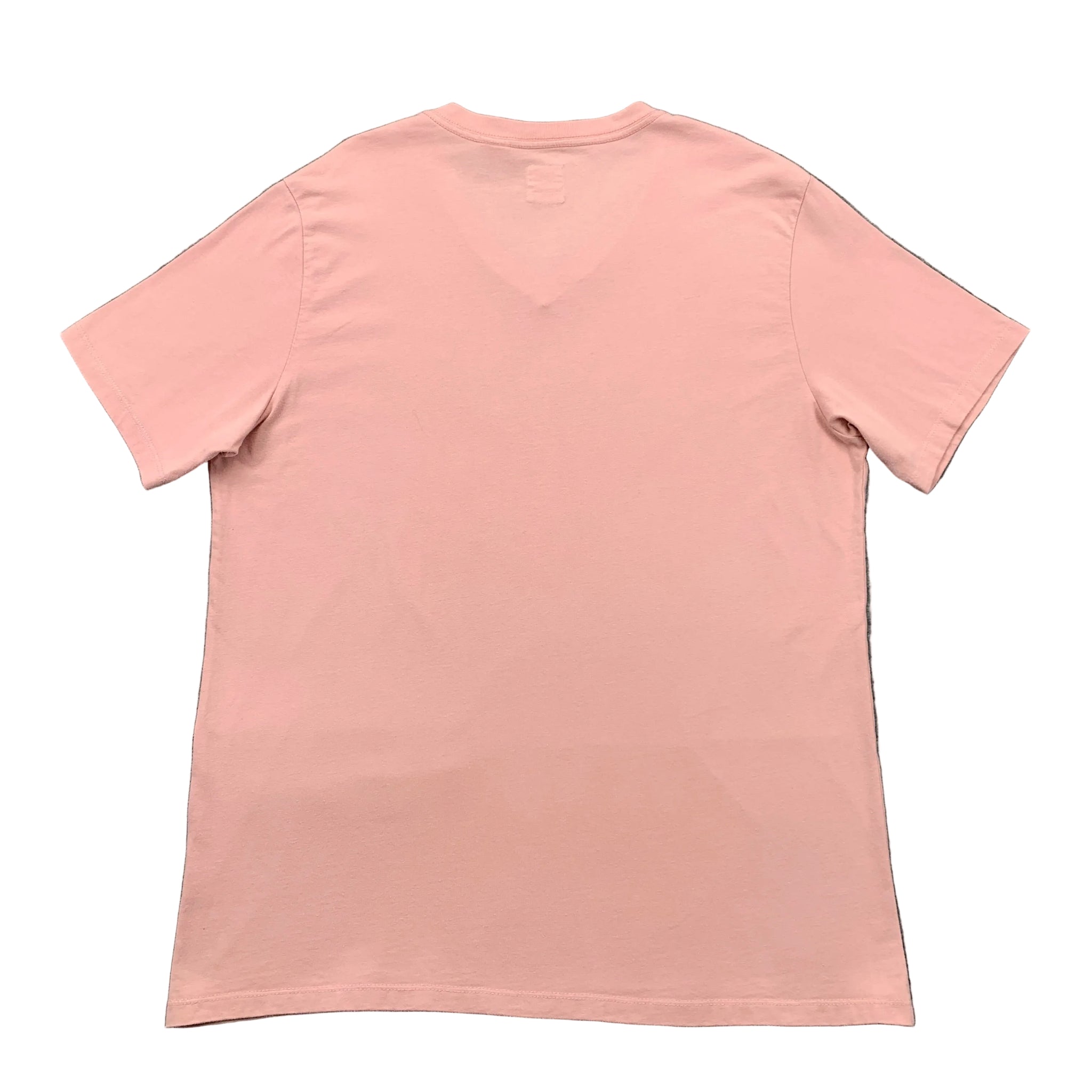 Pink t-shirt on a gray textured background