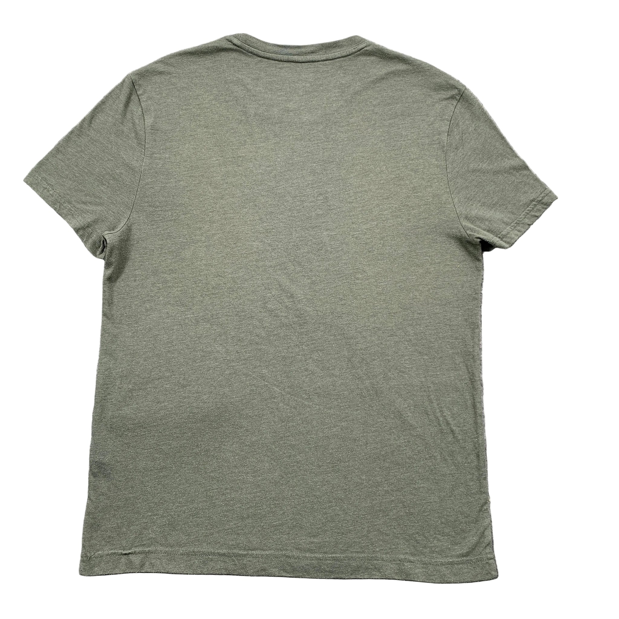 Green t-shirt on a textured gray surface