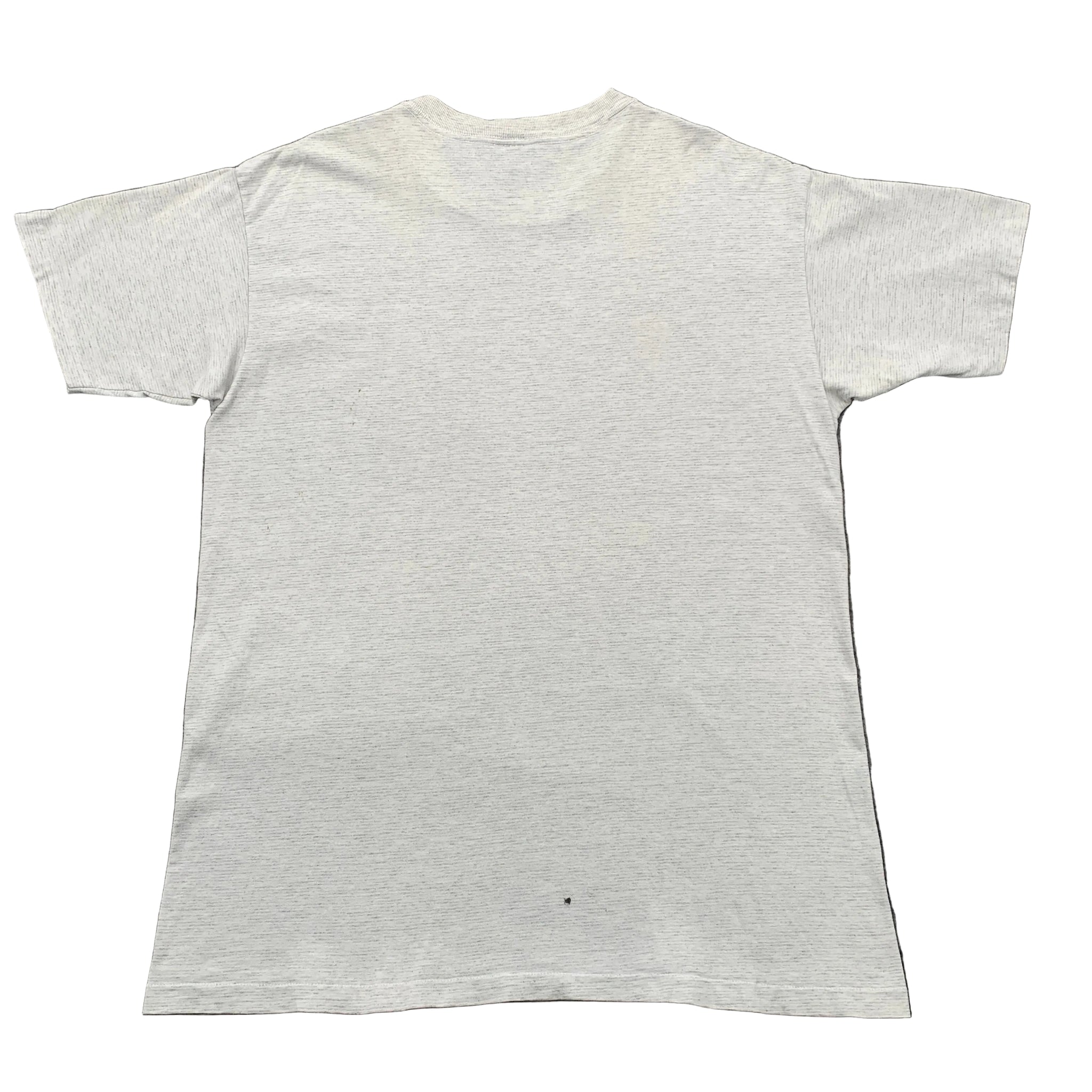 White t-shirt on a gray textured surface