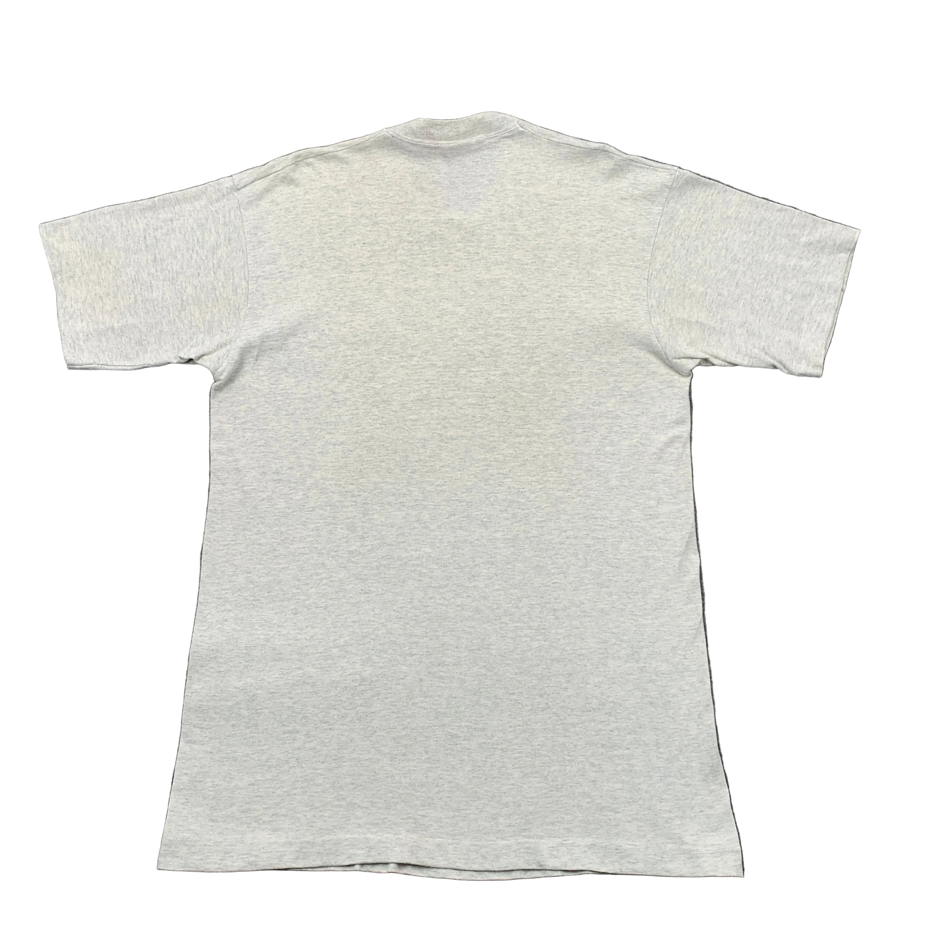 Plain white t-shirt on a gray background