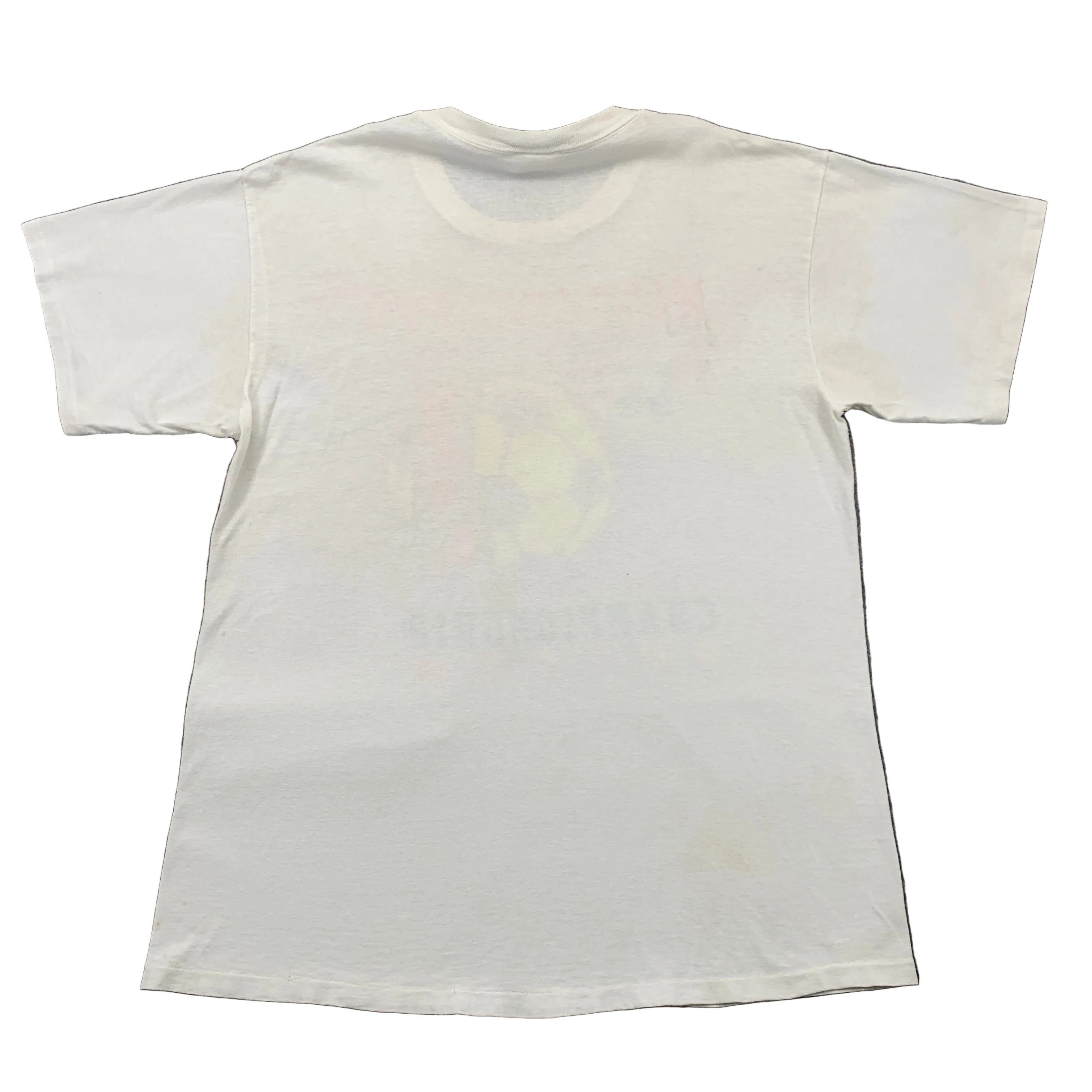 White t-shirt with a large stain on a gray surface