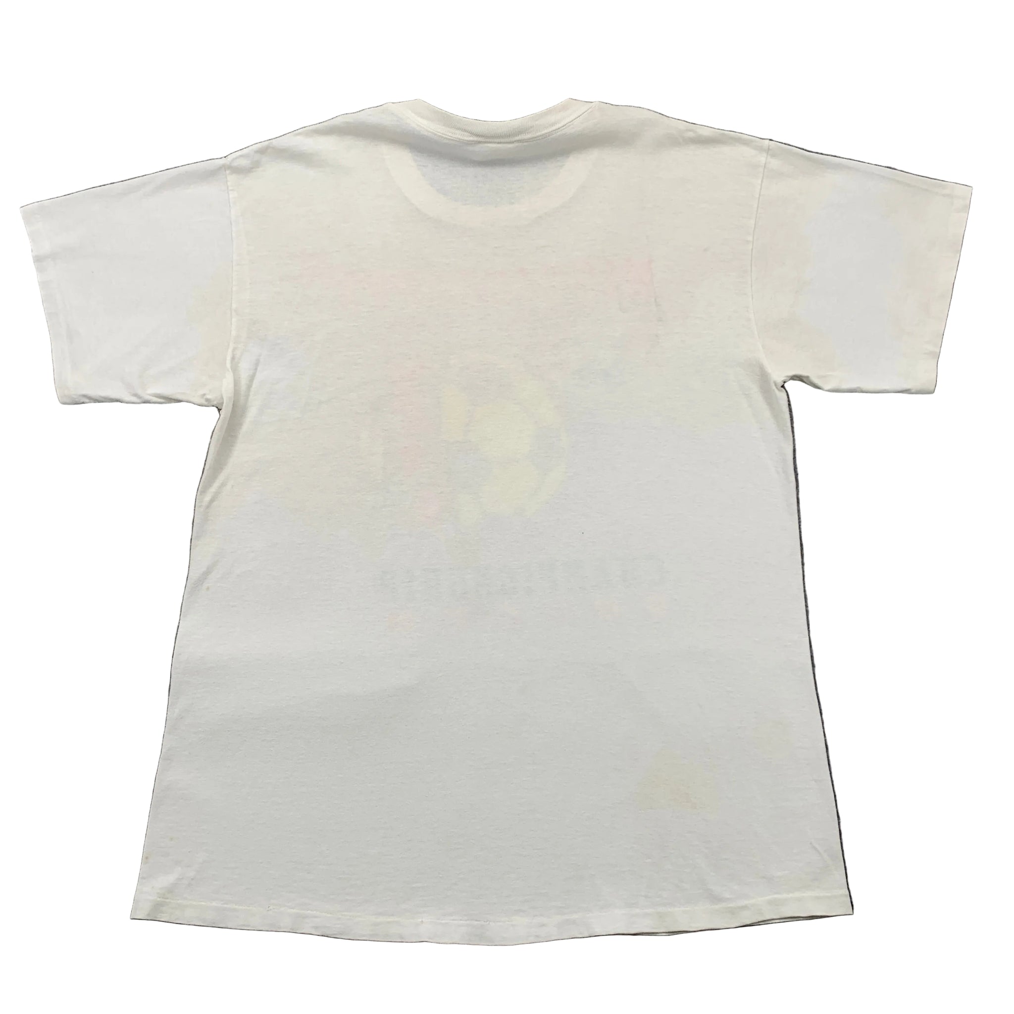 White t-shirt with a large stain on a gray surface