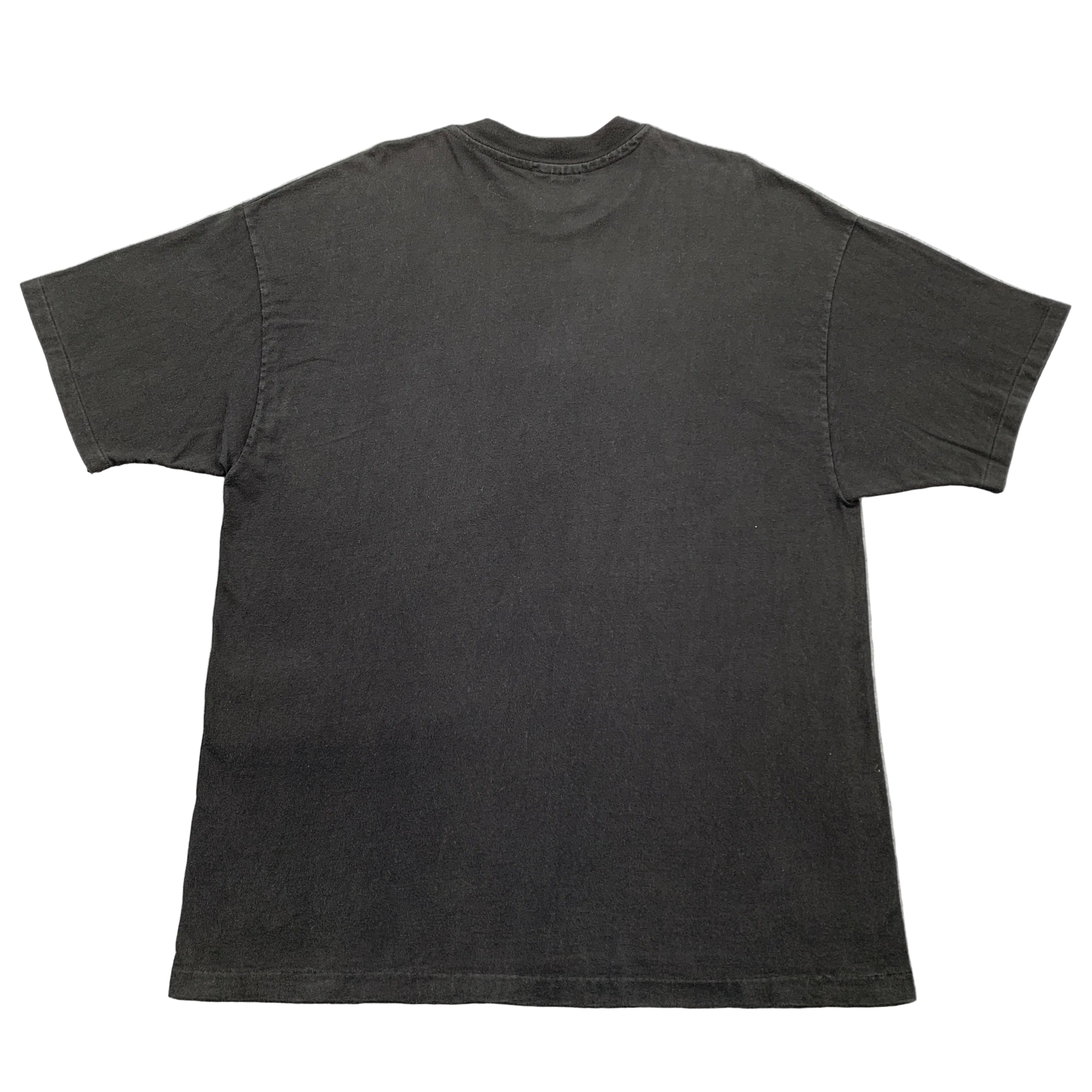 Black t-shirt on a gray textured surface