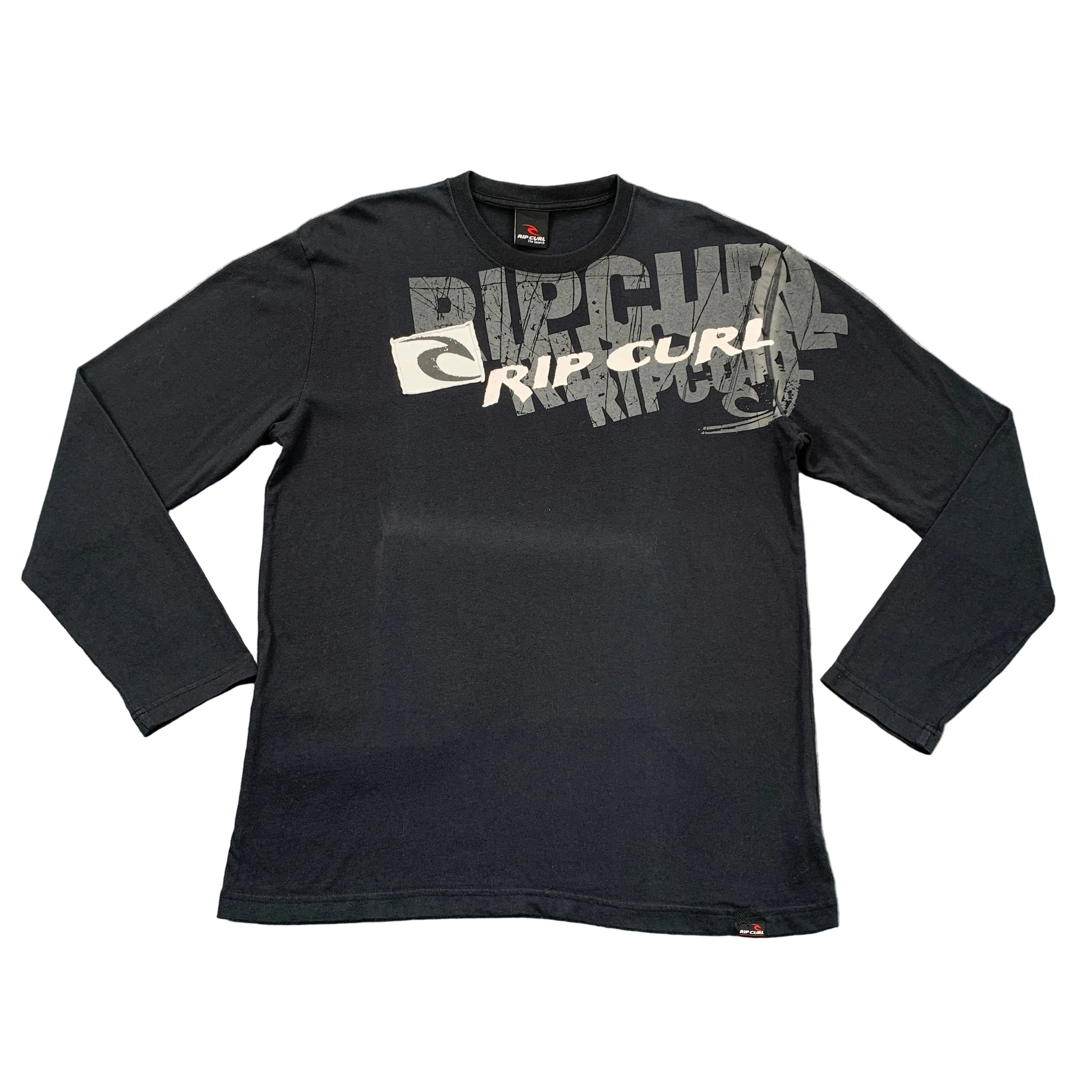 Black long-sleeve shirt with Rip Curl logo on a gray surface