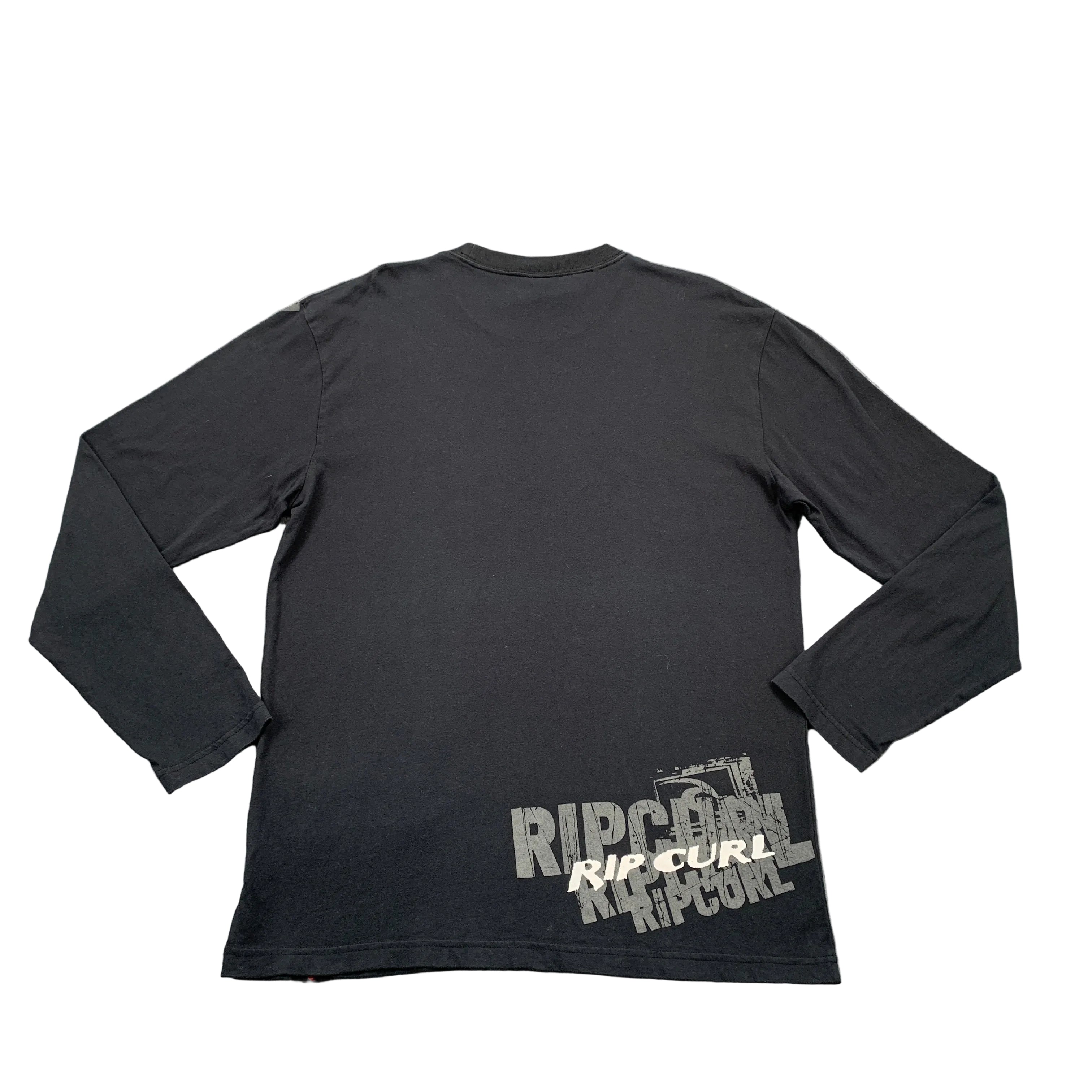 Black long-sleeve shirt with Rip Curl logo on a gray surface