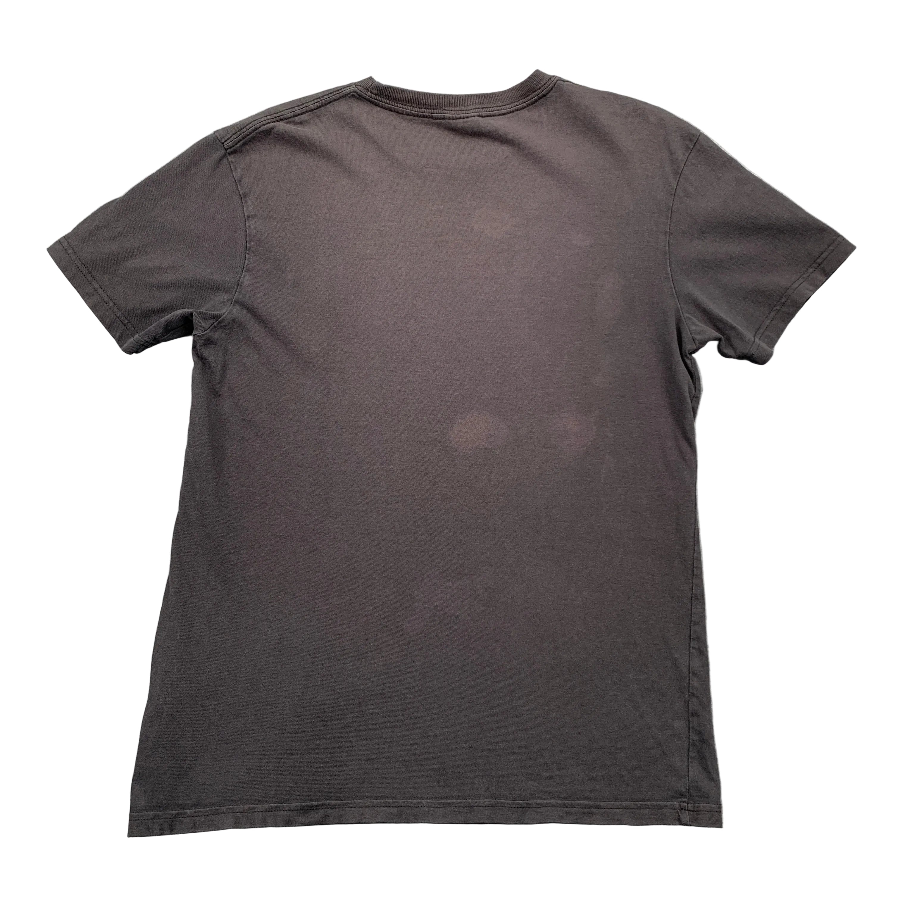 Black t-shirt on a gray textured surface