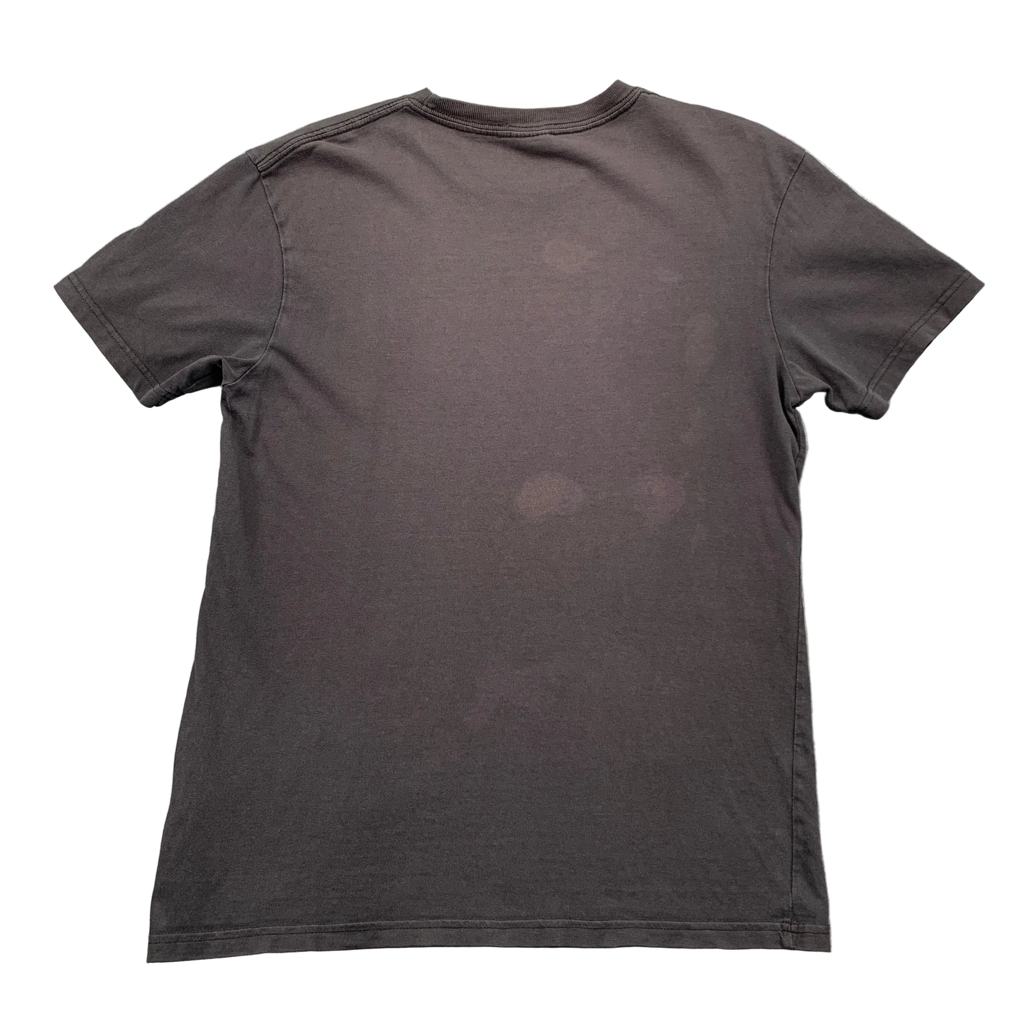 Black t-shirt on a gray textured surface