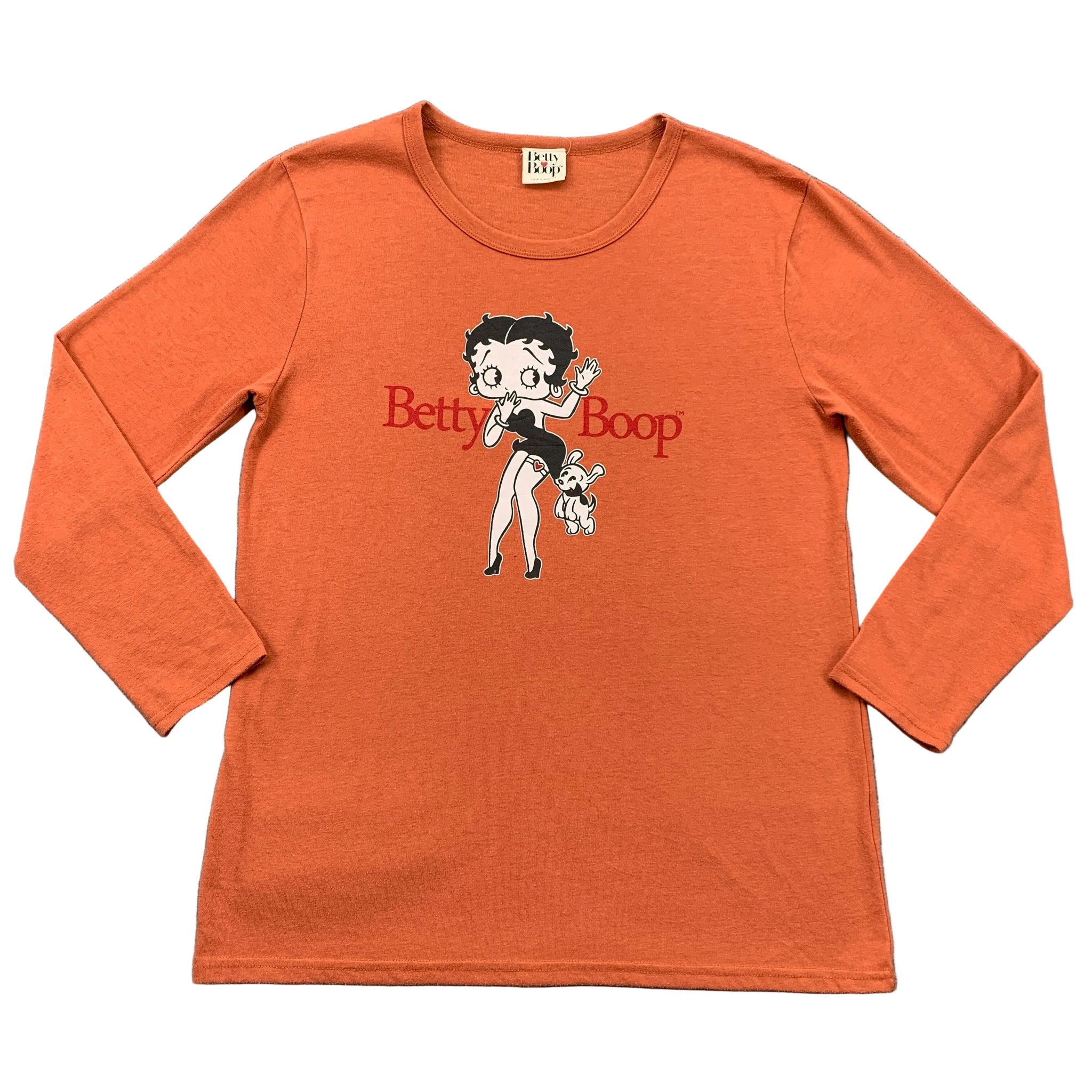 Orange long-sleeve shirt with Betty Boop design on a gray surface
