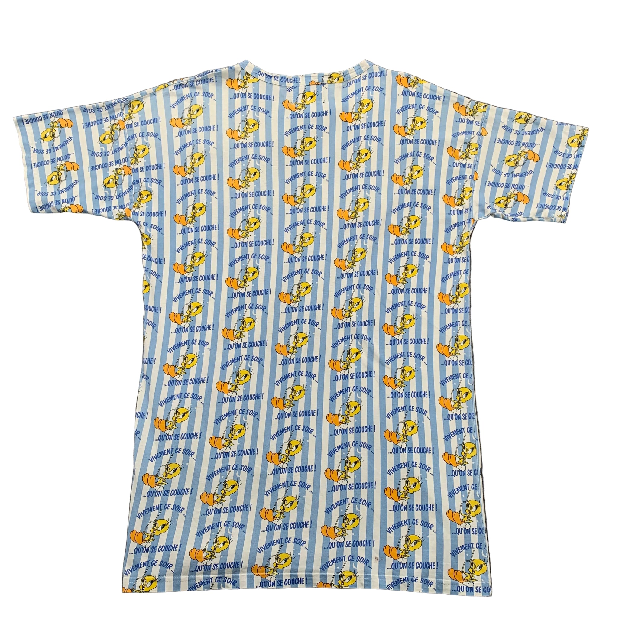 Short-sleeve shirt with cartoon character pattern on a gray surface