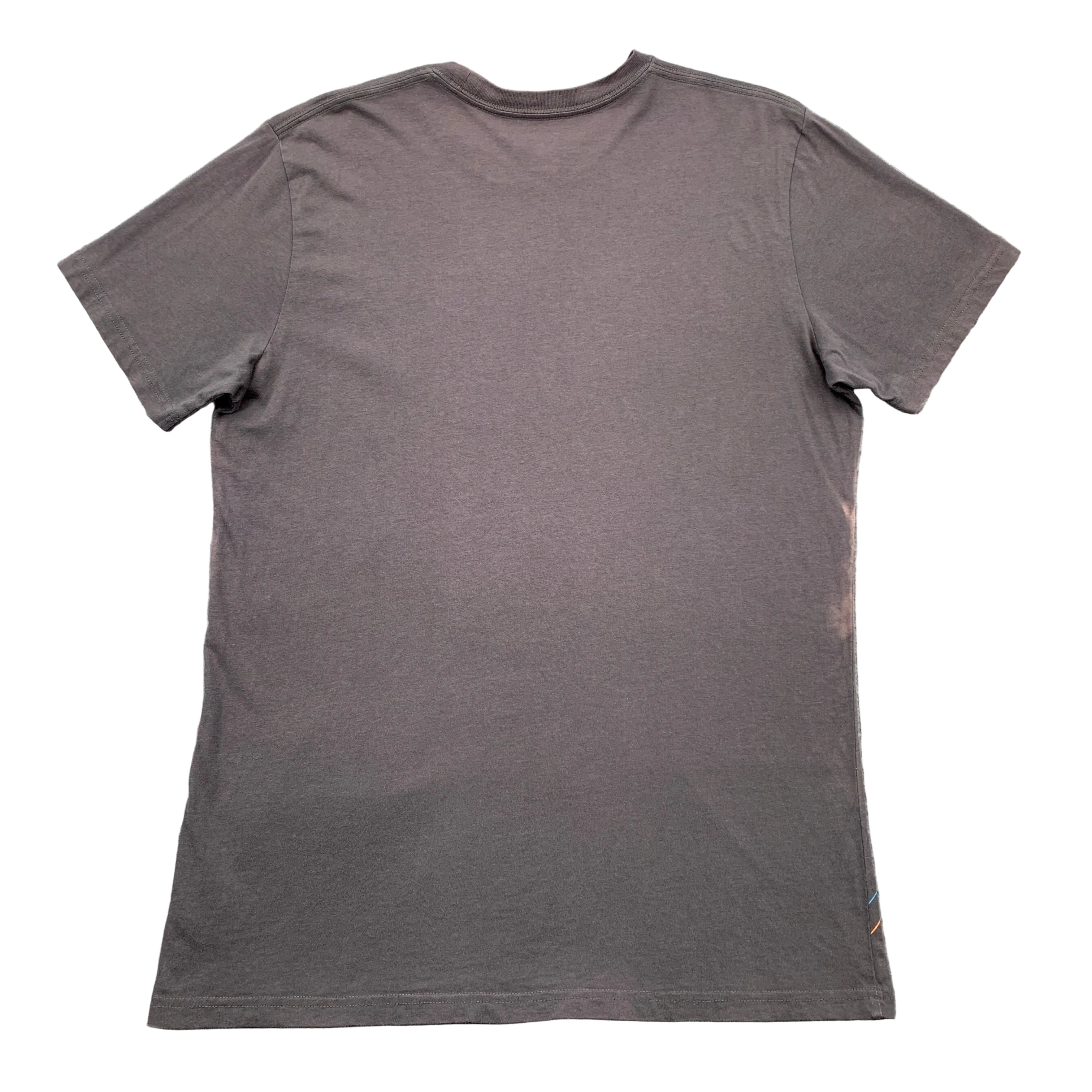 Gray t-shirt on a textured gray surface