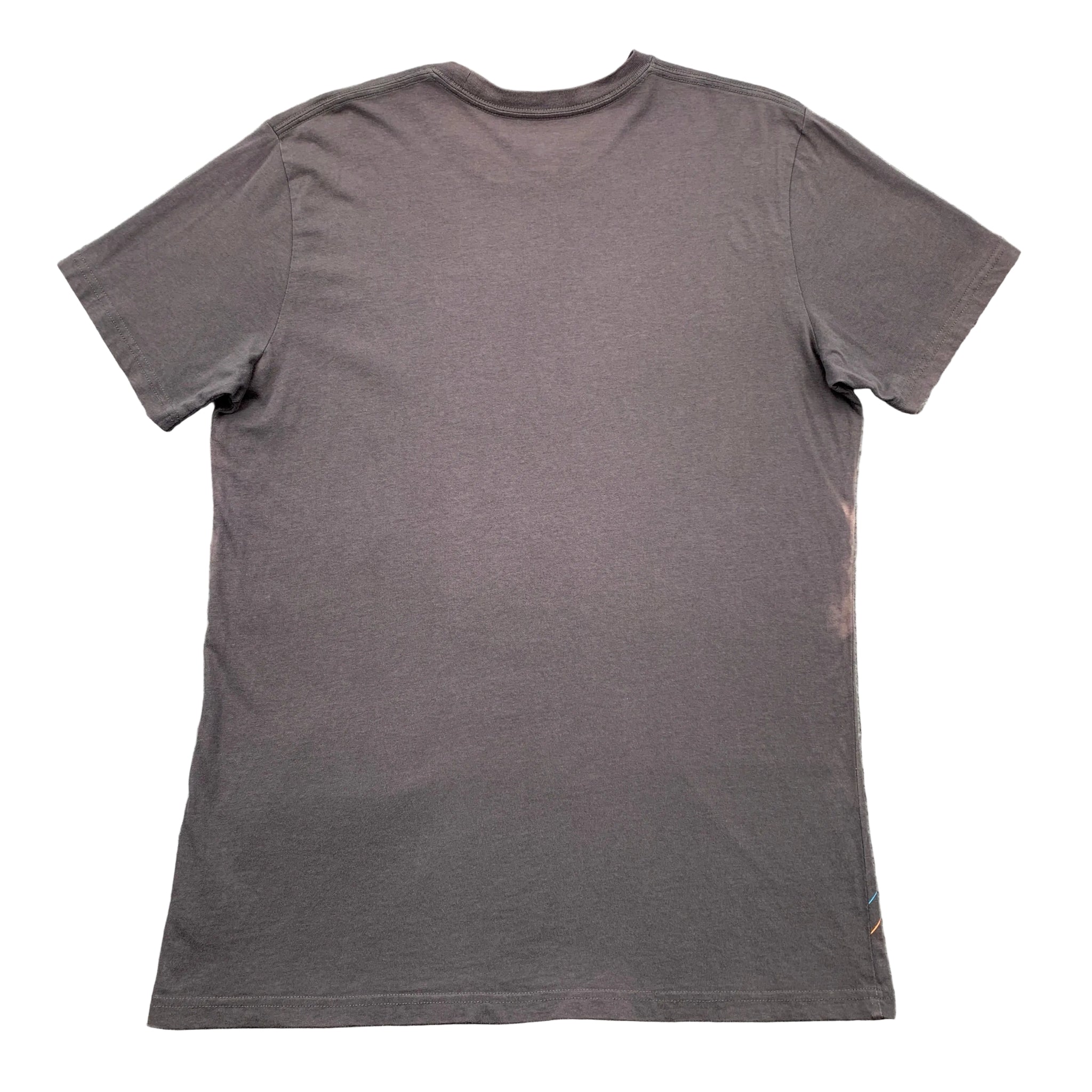 Gray t-shirt on a textured gray surface