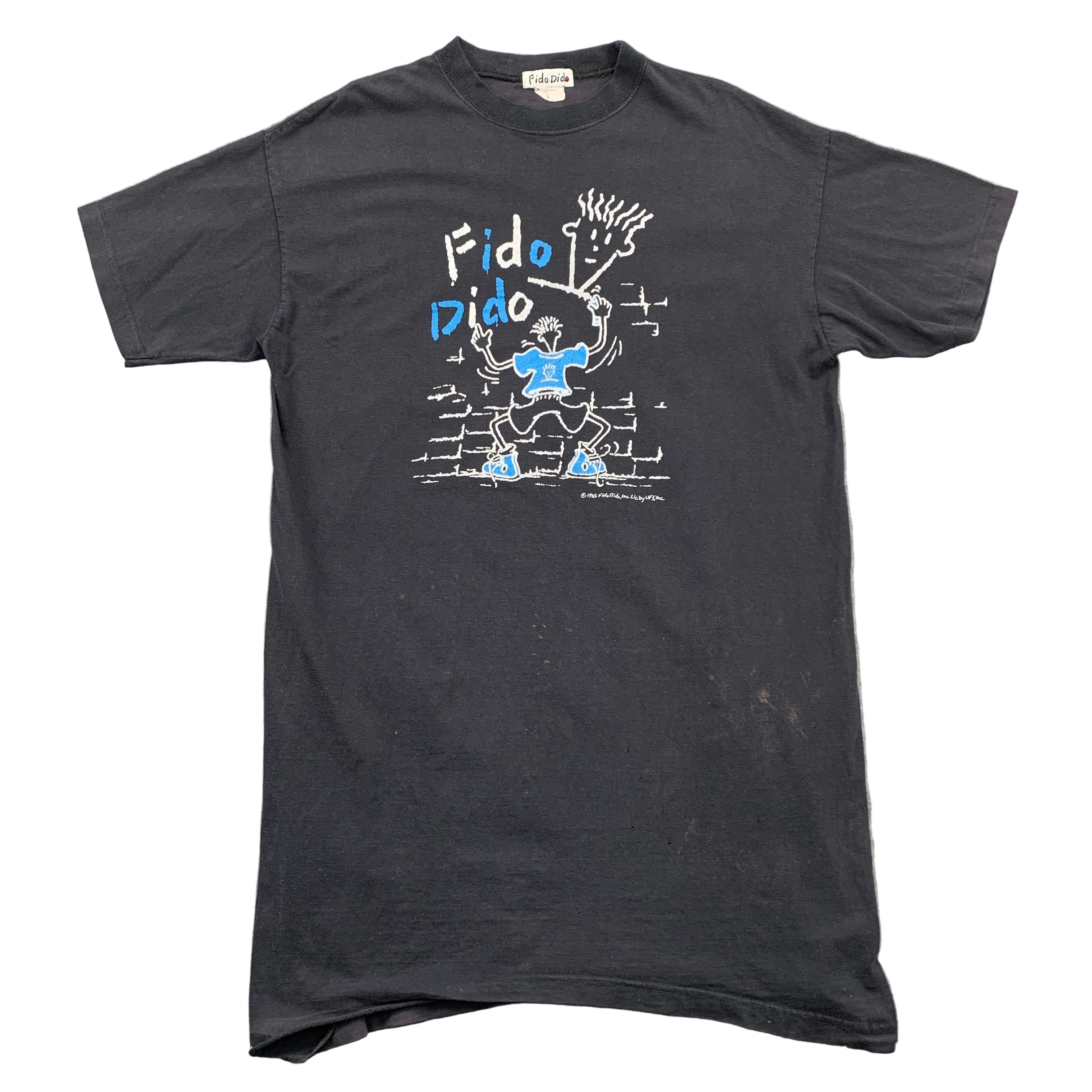 Black t-shirt with graphic design on a gray surface