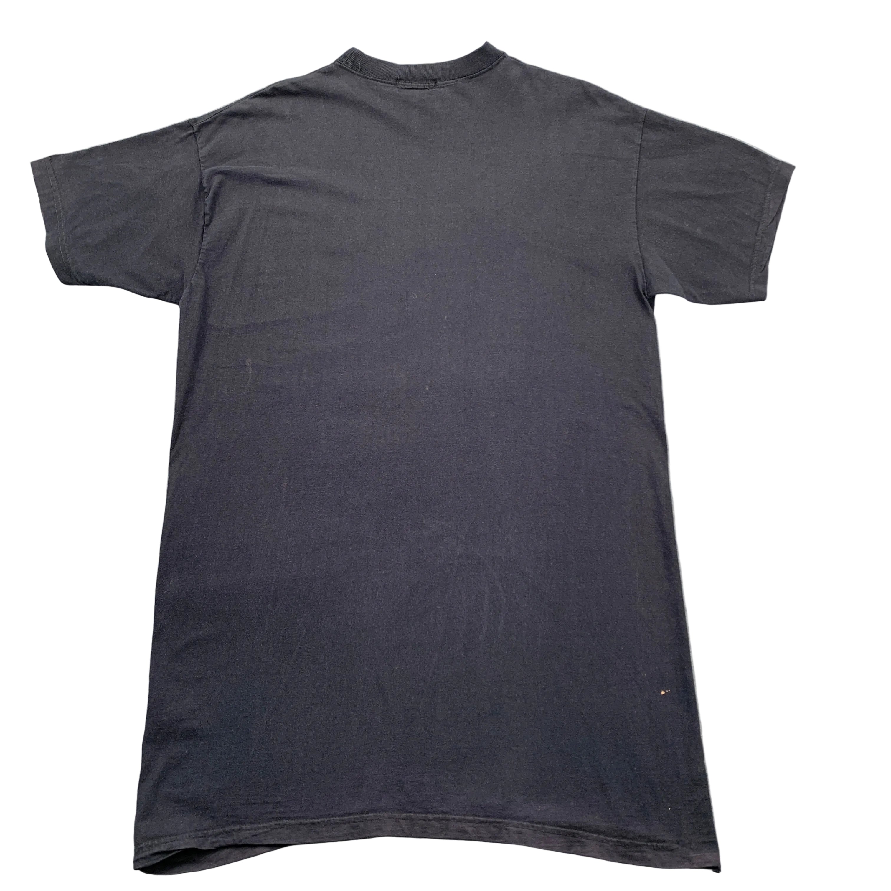 Black t-shirt on a gray textured surface