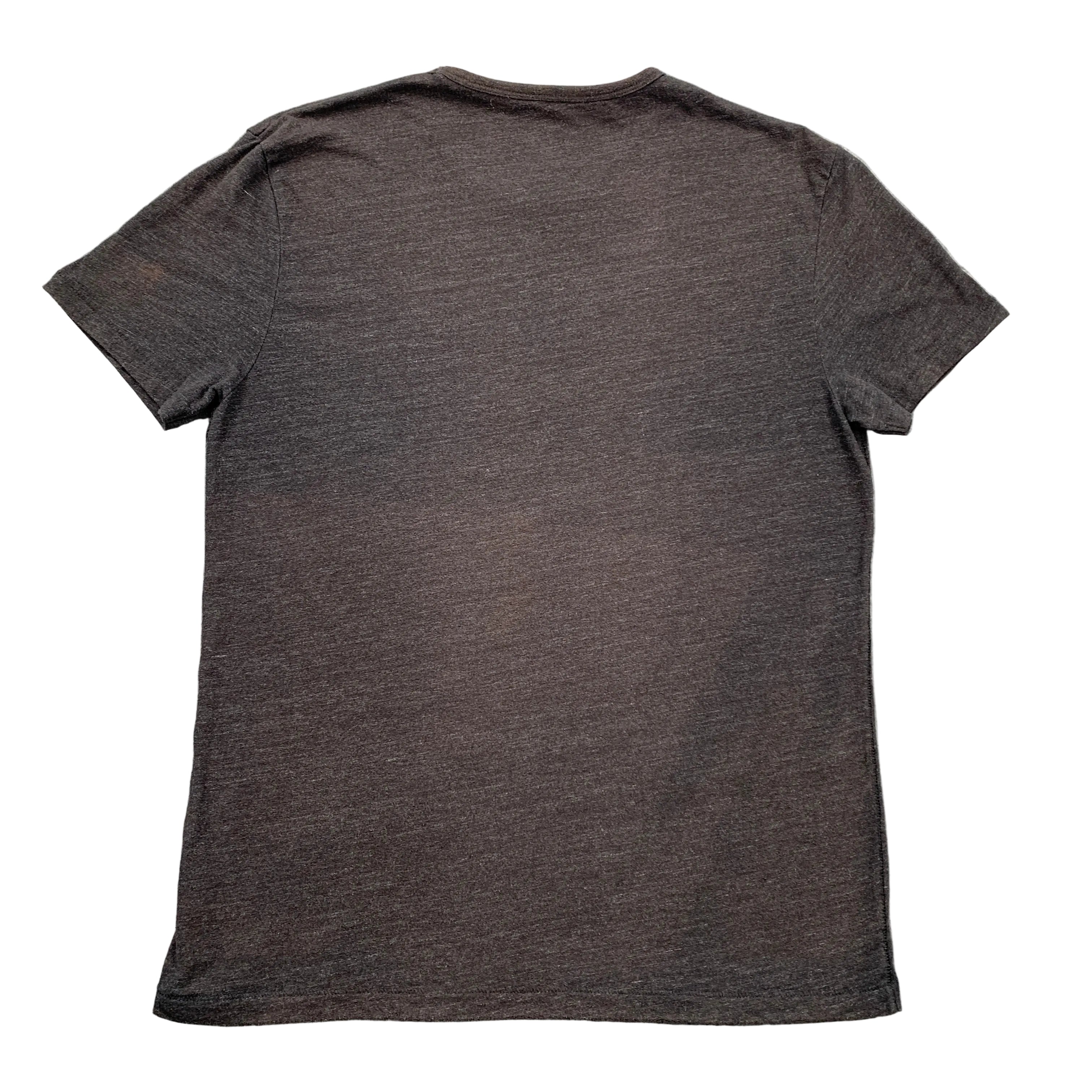 Dark gray t-shirt on a textured gray surface