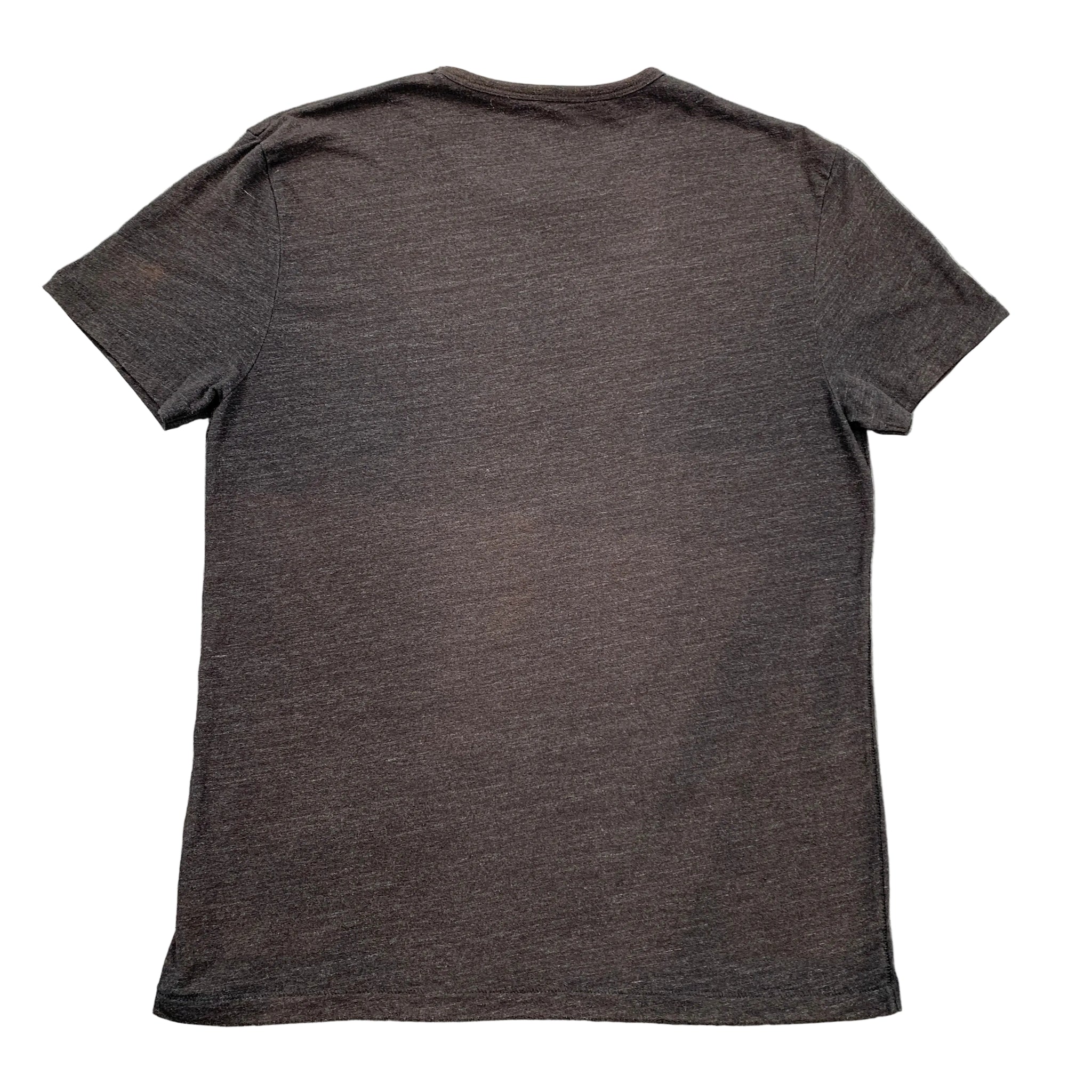 Dark gray t-shirt on a textured gray surface