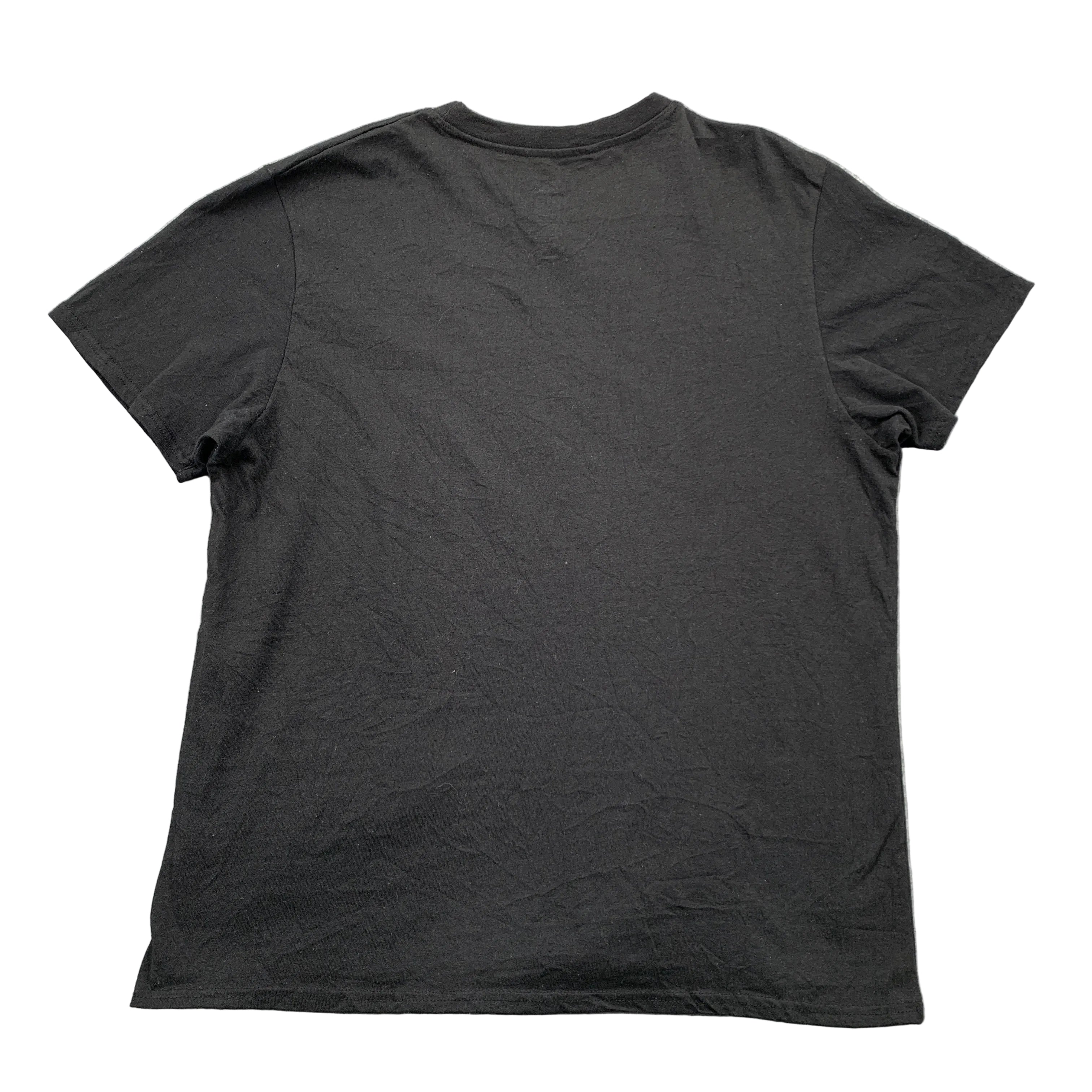 Black t-shirt on a gray textured surface