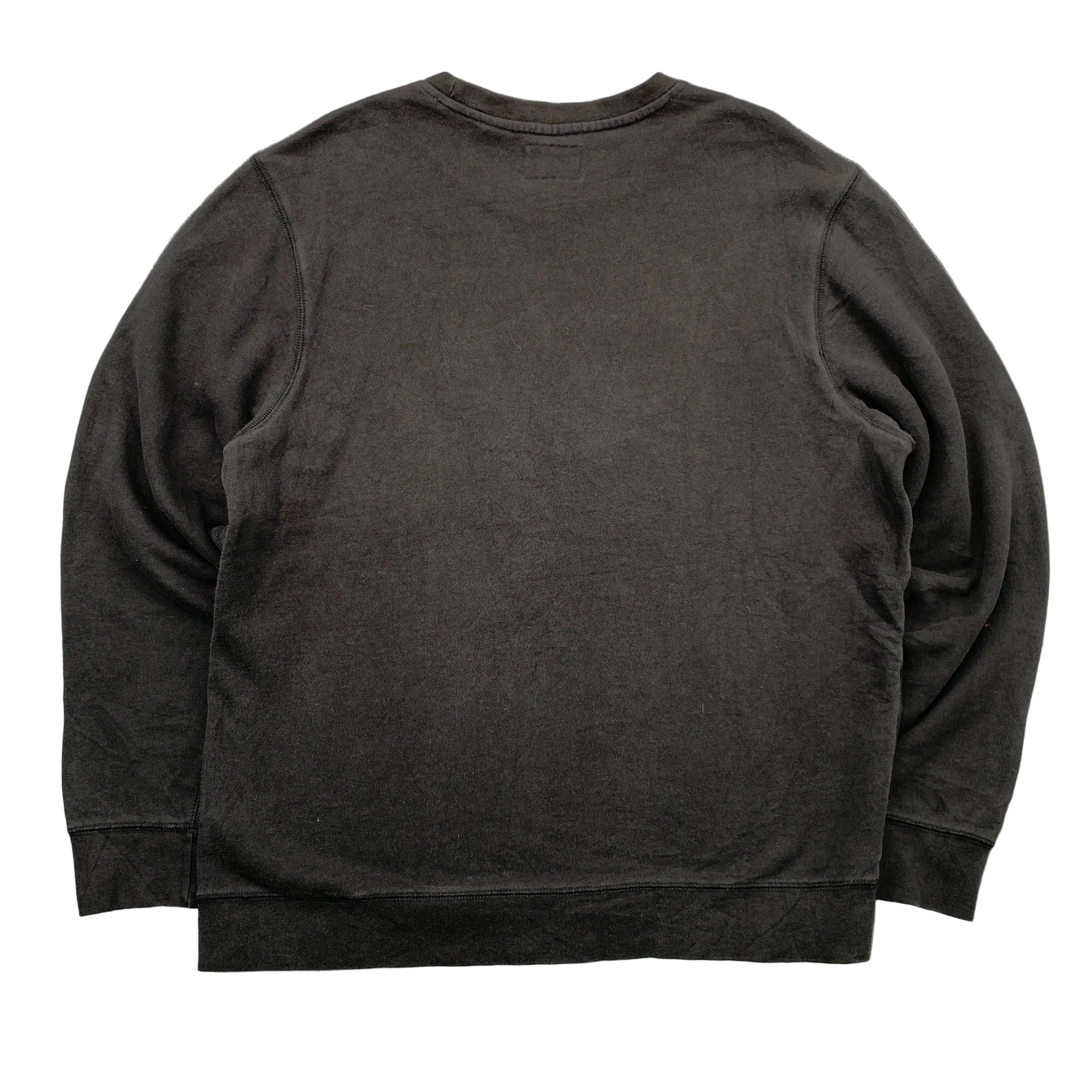 Black sweatshirt on a gray textured background